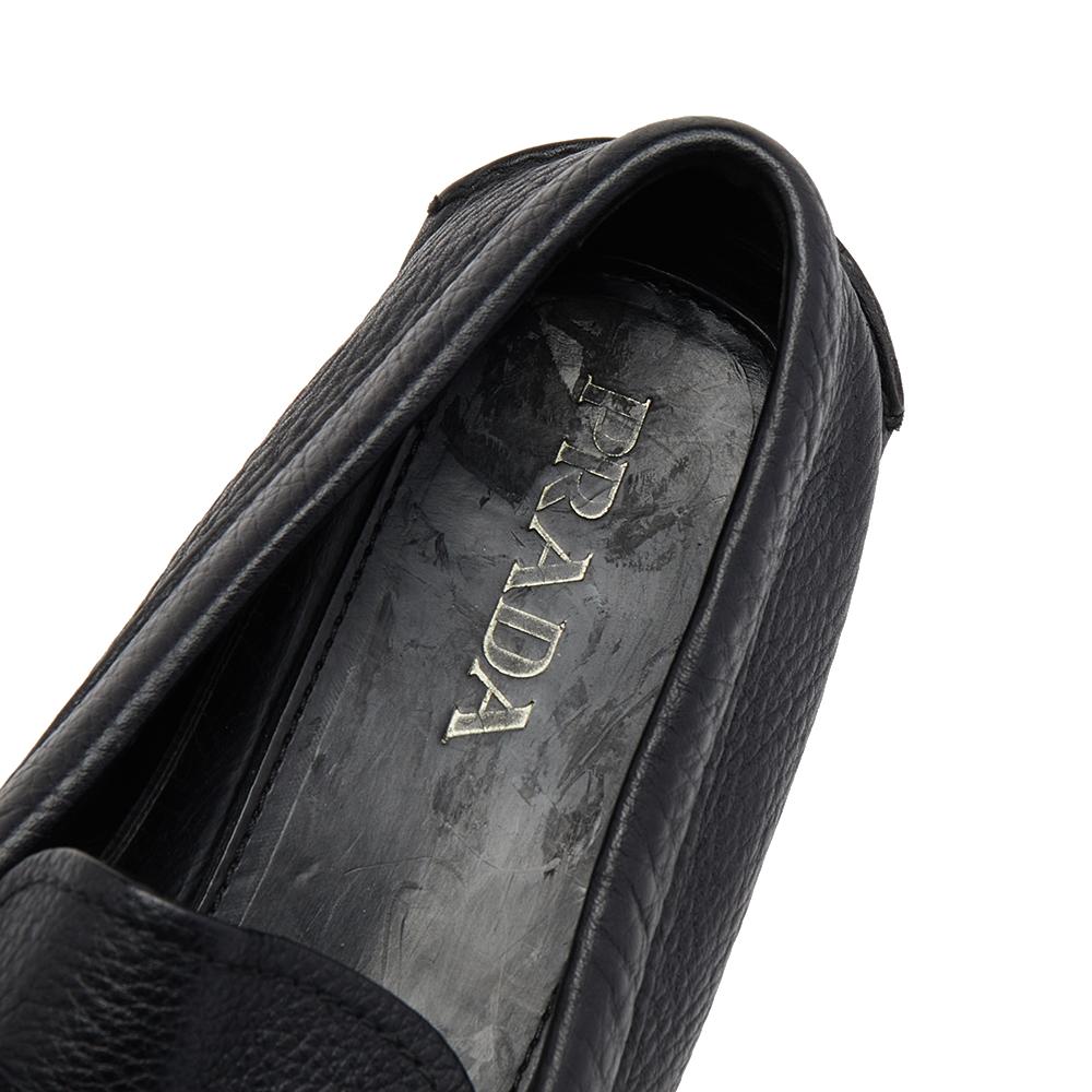 This pair of Prada’s loafers combine comfort and style. Crafted from black leather, they feature a round toe, penny keeper strap, leather-lined insole and leather & rubber sole. This pair can be teamed up with both work and casual attire.

