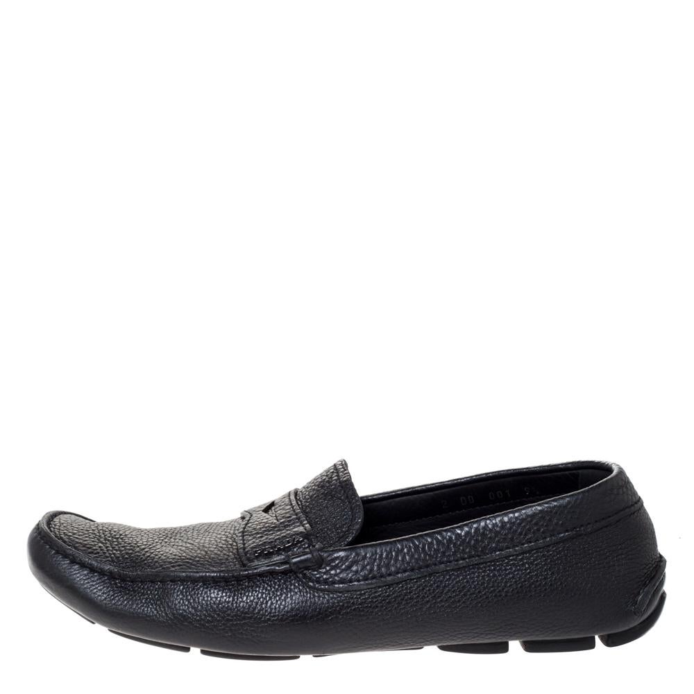 Stylish and super comfortable, this pair of loafers by Prada will make a great addition to your shoe collection. They have been crafted from quality leather and styled with logo detailing in gunmetal-tone on the vamps. Leather insoles and rubber