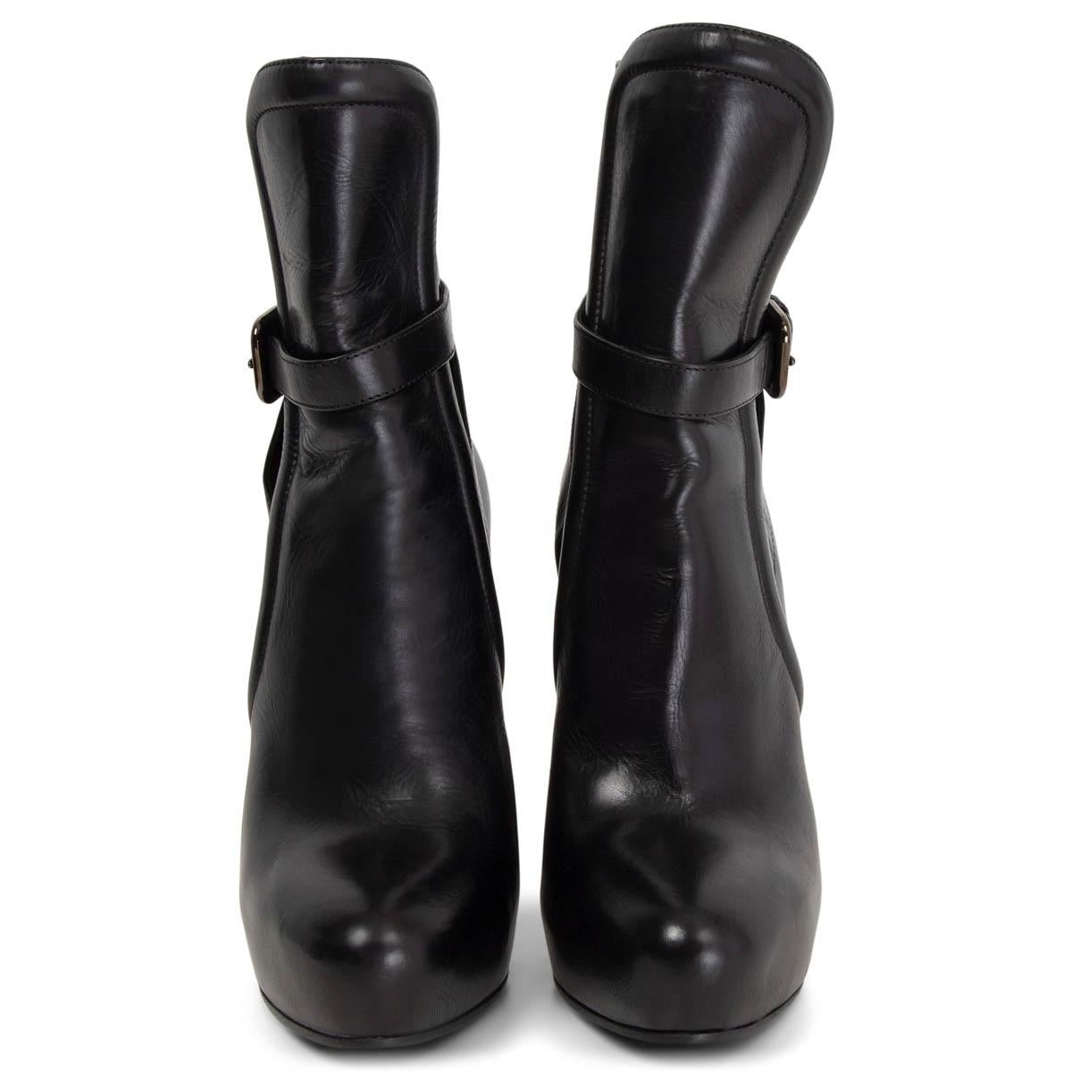 100% authentic Prada platform ankle-boots in black calfskin with gunmetal buckle detail on the side. Have been worn once inside and are in virtually new condition. 

Measurements
Imprinted Size	36
Shoe Size	36
Inside Sole	23cm (9in)
Width	6.5cm