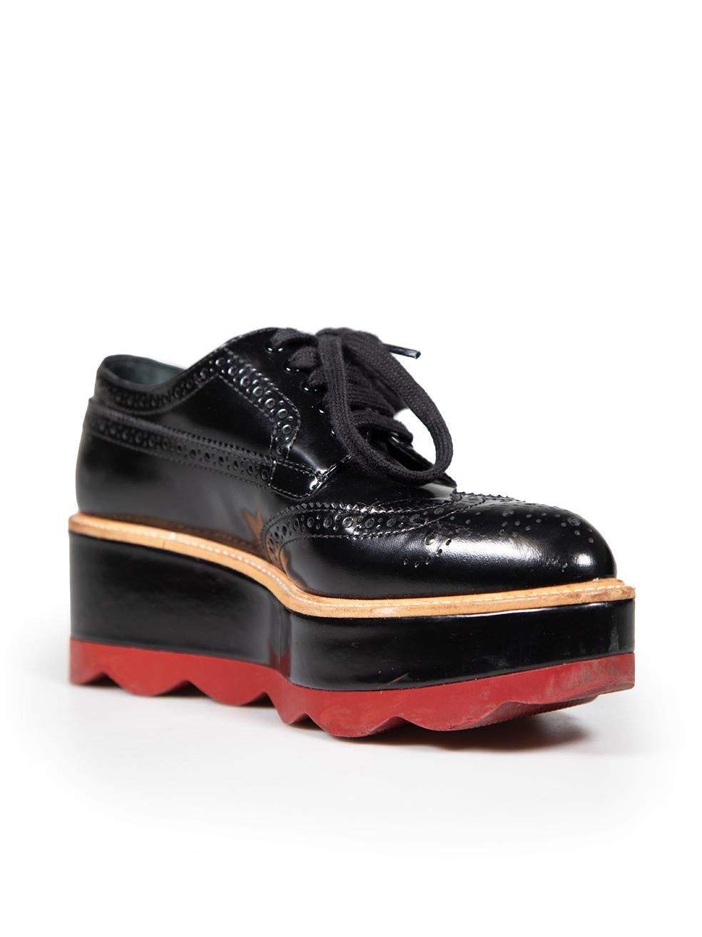 CONDITION is Very good. Minimal wear to shoes is evident. Minimal wear to leather platforms with marks seen on both shoes on this used Prada designer resale item.
 
 
 
 Details
 
 
 Black
 
 Leather
 
 Brogues
 
 Perforated pattern
 
 Platform
 
