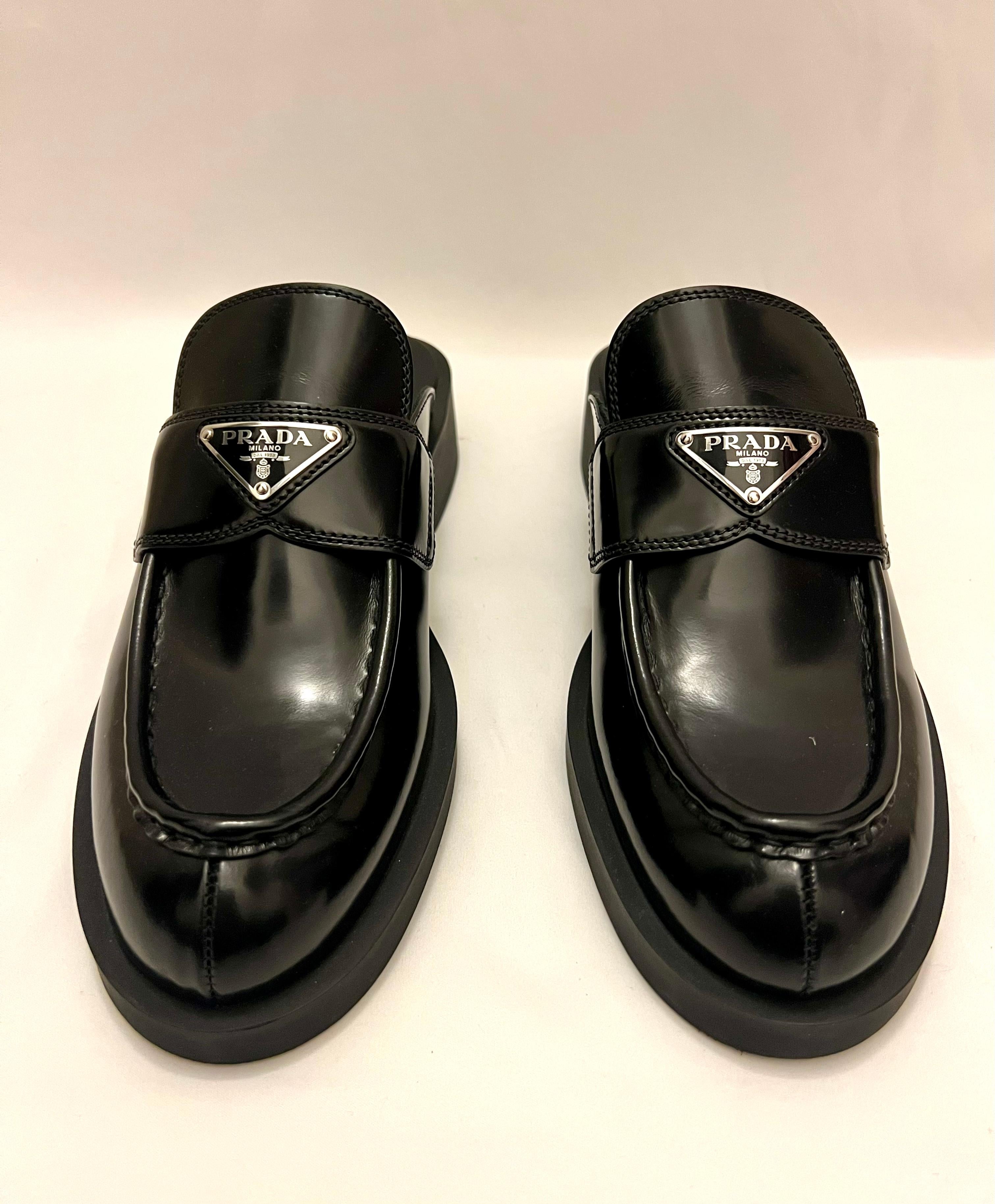 The shoes are brand new and have never been worn. They feature Prada logo detail on the front. They are made out of calfskin with platform sole and chunky heel. 