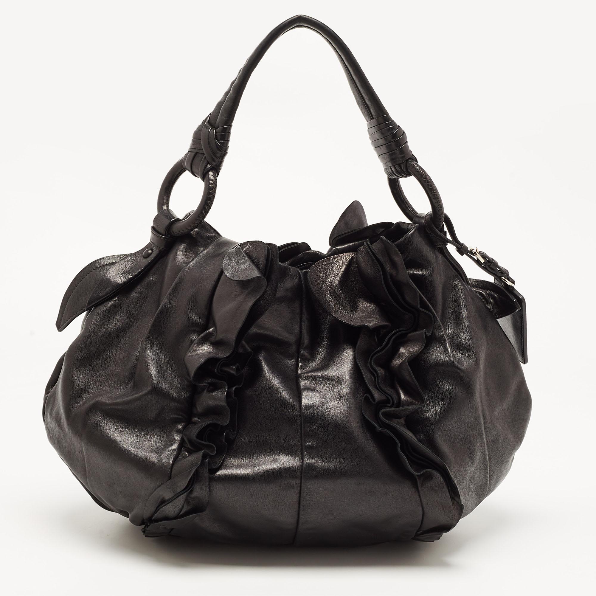 For a look that is complete with style, taste, and a touch of luxe, this designer bag is the perfect addition. Flaunt this beauty on your shoulder and revel in the taste of luxury it leaves you with.

Includes: Original Dustbag

