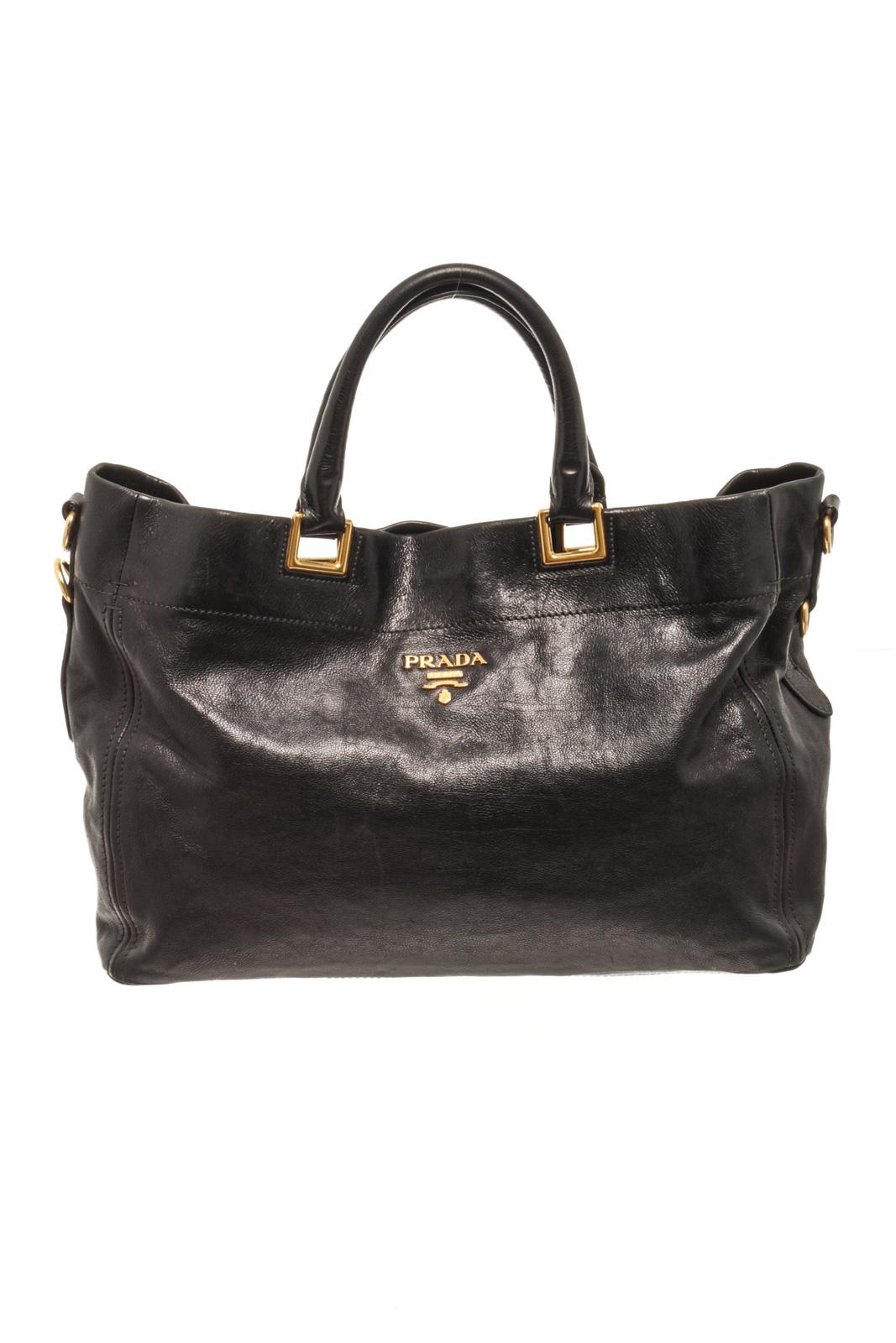 Prada Black Leather Shoulder Bag with top handle, detachable shoulder strap, gold tone hardware, suede lining, two interior slip pockets, zipper closure. There are stains on the suede lining. Please refer to photos.

86620MSC