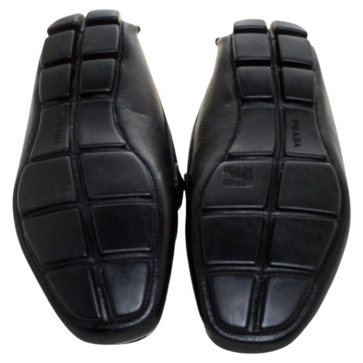 Look sharp and neat with this pair of loafers from Prada. They have been crafted from black leather and designed with the brand label accent on the uppers. The pair is complete with comfortable insoles and rubber-accented soles.