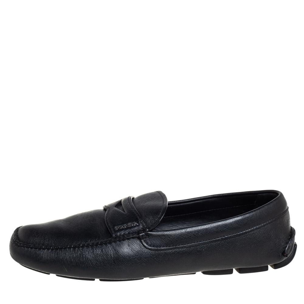 When comfort means luxury, we get these Prada loafers! Crafted from leather in a versatile black shade, they are augmented with penny keeper straps on the uppers. Comfortable insoles, neat stitches, and sturdy rubber soles.

