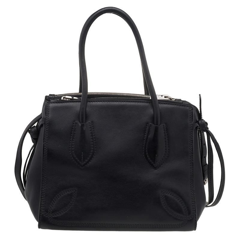 Feminine in shape and grand in design, this Double Zip tote by Prada will be a loved addition to your closet. It has been crafted from leather and styled minimally with silver-tone hardware and stitch detailing. It comes with two top handles, two