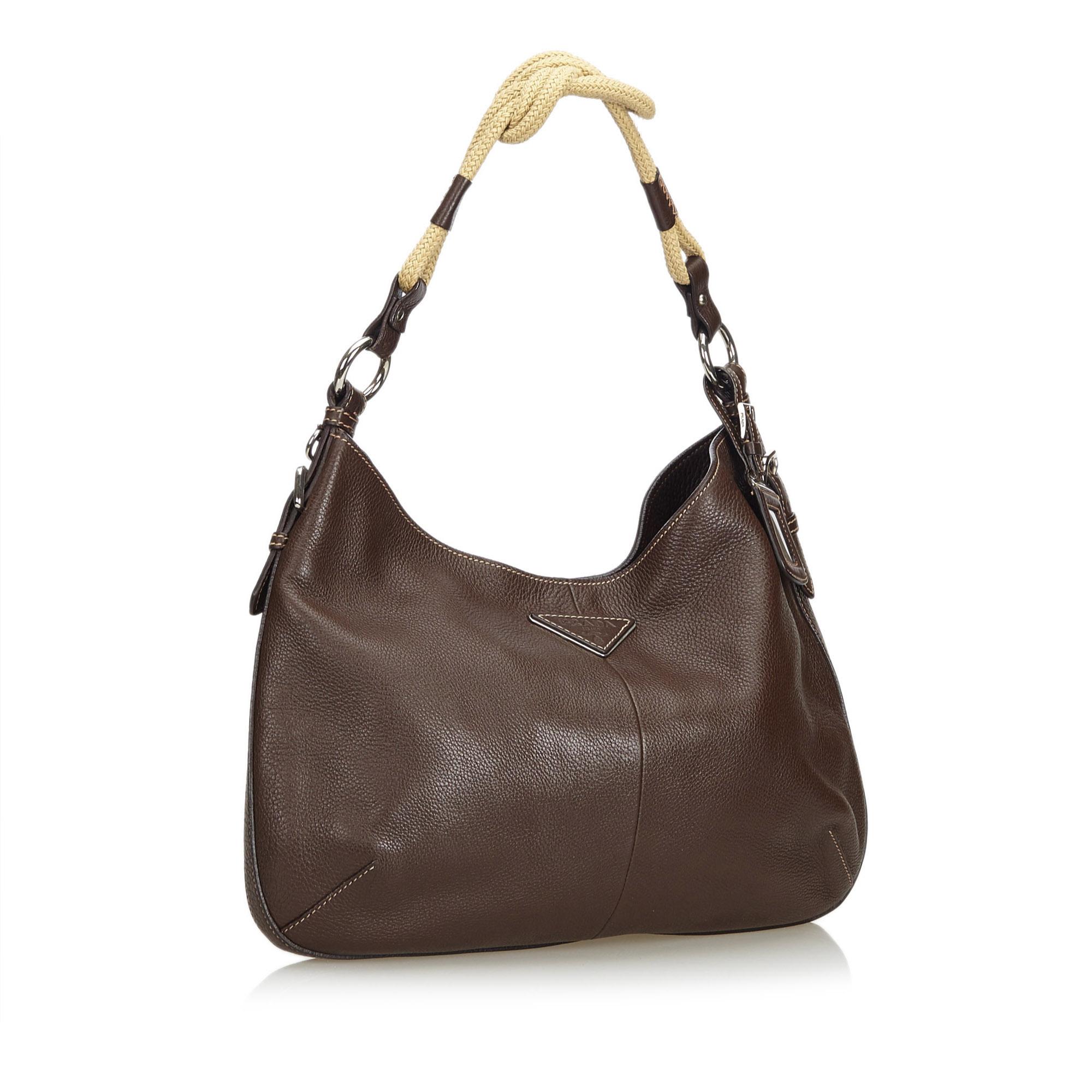 This hobo bag features a leather body, a tied rope strap, a top zip closure, and an interior zip compartment. It carries as AB condition rating.

Inclusions: 
This item does not come with inclusions.

Dimensions:
Length: 26.00 cm
Width: 37.00