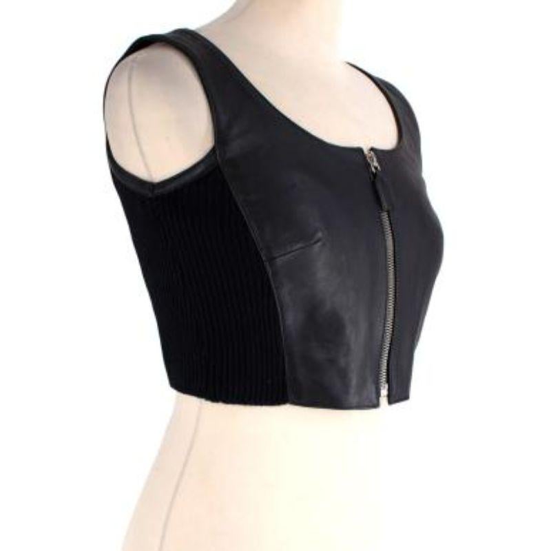 Prada black leather zip-front cropped bustier top

- Made of soft leather 
- zip front
- Sleeveless. 
- cropped fit

Made in Italy. 
Dry clean only. 
Condition 9.5/10.

PLEASE NOTE, THESE ITEMS ARE PRE-OWNED AND MAY SHOW SIGNS OF BEING STORED EVEN