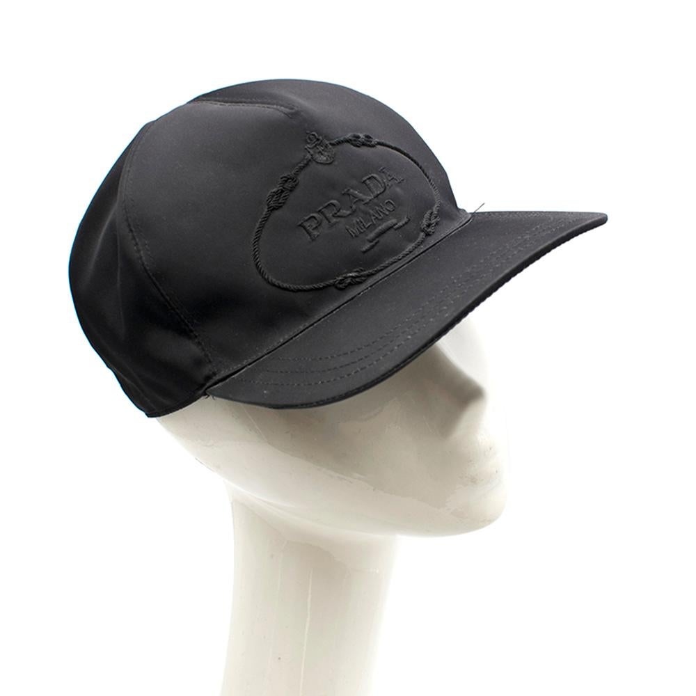 Prada Logo Baseball Cap

Prada logo baseball cap, 
Front Prada logo embroidery,
Adjustable fastening, 
Curved peak,
Stitched detailing, 
100% Nylon, 
Soft lambskin trim, 
Wool lining

Box included. 

Please note, these items are pre-owned and may