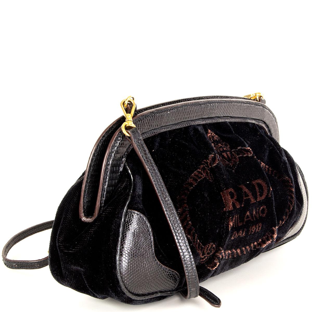 100% authentic Prada logo print cross-body bag in black velvet and lizard embossed leather strap and trimmings. Opens with two magnetic buttons on top and is lined in black nylon with one open pocket against the back. Has been worn and is in