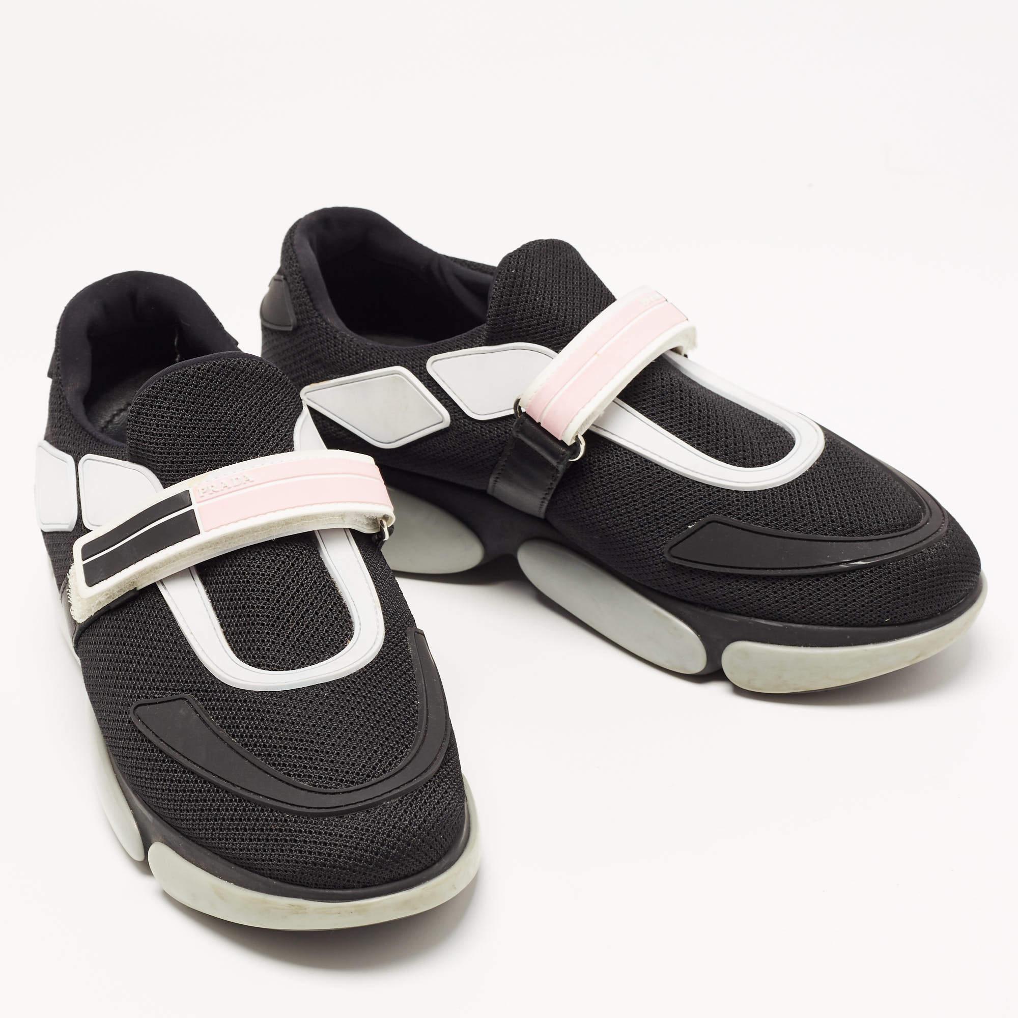 Elevate your footwear game with these Prada black sneakers. Combining high-end aesthetics and unmatched comfort, these sneakers are a symbol of modern luxury and impeccable taste.


