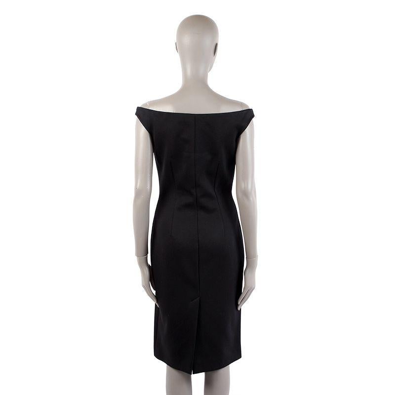 Prada sleeveless sheath dress in black modal (69%), polyamide (29%), and other fibres (2%). With boat neck and back slit. Closes with invisible side zipper. Unlined. Has been worn and is in excellent condition.

Tag Size 44
Size L
Shoulder Width