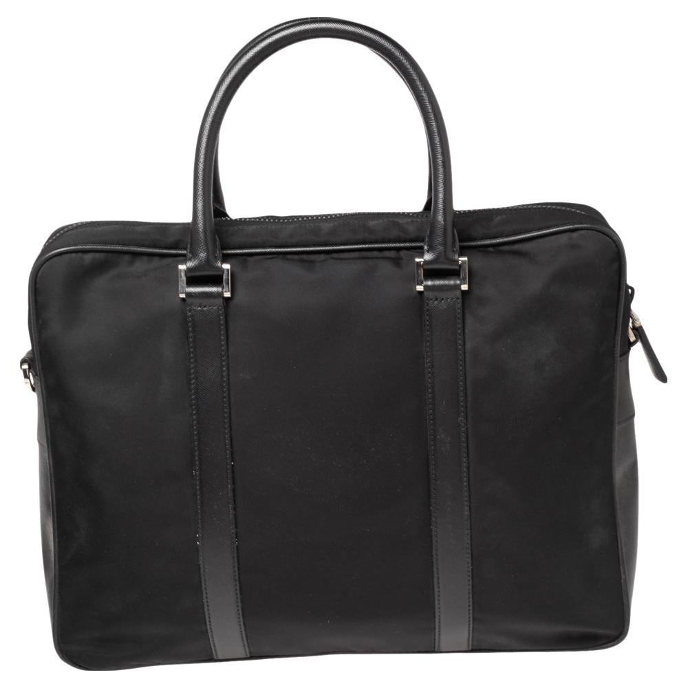 This Prada briefcase in nylon and leather has a classy design. Beautifully crafted, the briefcase for women comes with a highly durable exterior, a nylon interior, two top handles, and an adjustable shoulder strap.

Includes: Strap, Authenticity