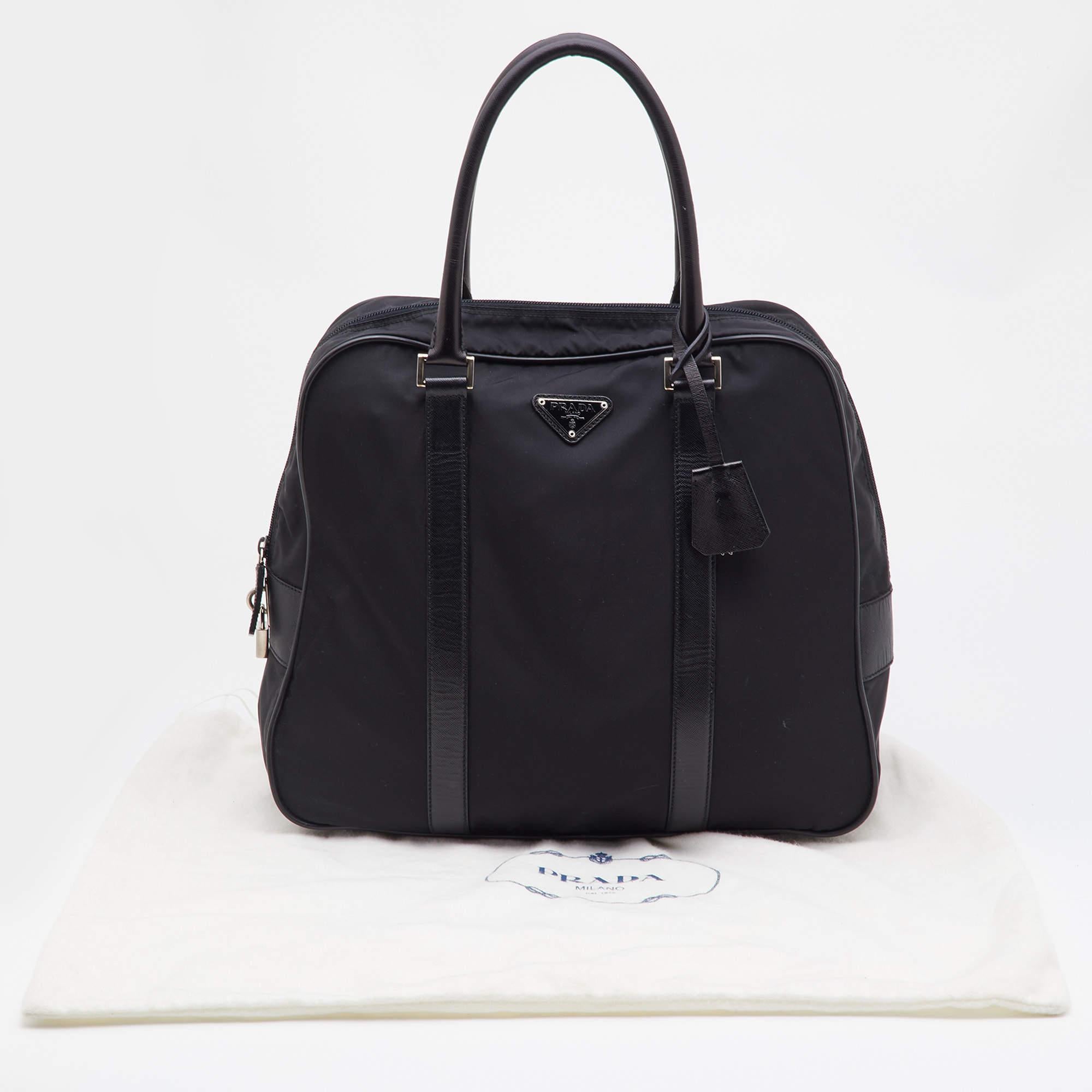 This Prada accessory is an example of the brand's fine designs that are skillfully crafted to project a classic charm. It is a functional creation with an elevating appeal.

Includes: Original Dustbag, Padlock and Keys
