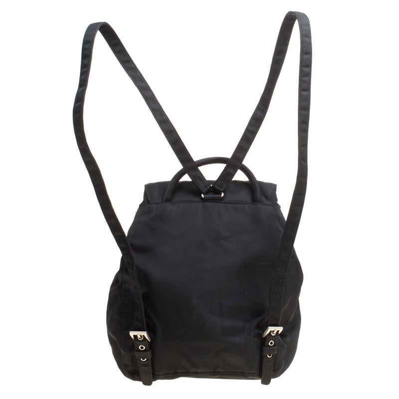 Get set to look uber stylish with this black backpack from Prada. Crafted from nylon, it flaunts a nylon interior secured by a drawstring, a flap and shoulder straps. This piece is very much in vogue, so get your hands on this today!

Includes: The