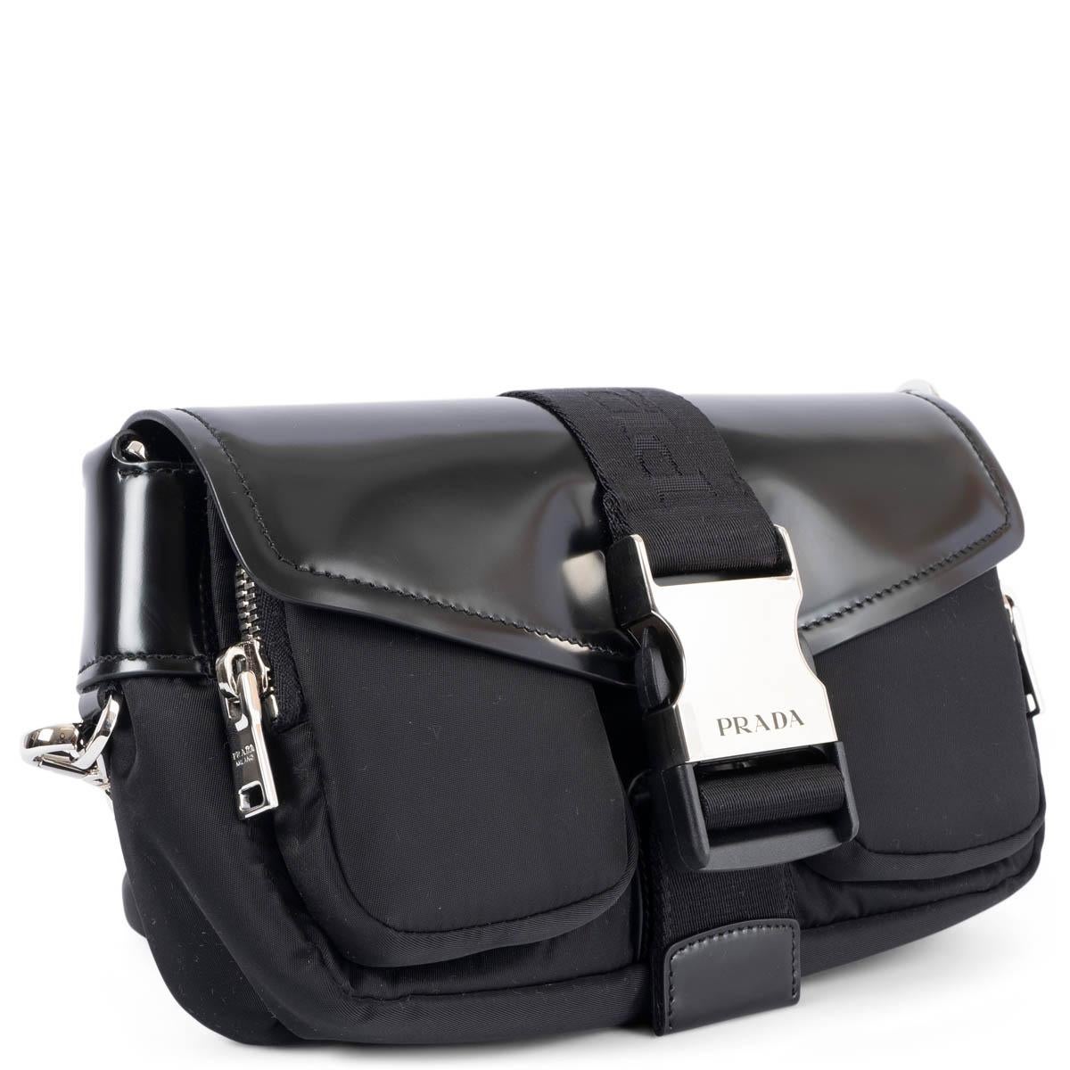100% authentic Prada Pocket crossbody bag in black nylon with a smooth glossy leather flap. The design features a detachable and adjustable shoulder strap with a detachable zip pocket, silver-tone buckle closure, two zip front pockets and one slit