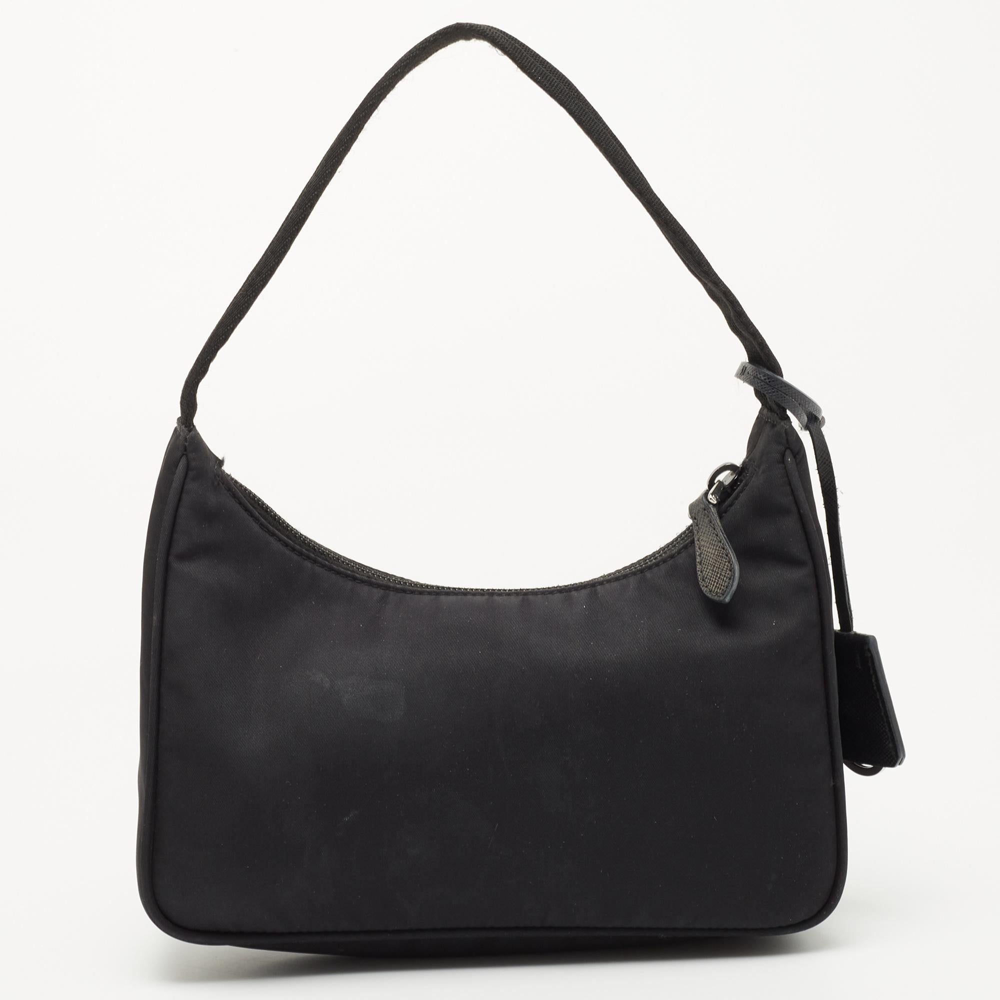 The bag that has caught the instant fancy of celebrities, bloggers, and everyone fashionable, Re-Edition 2000 from Prada is one of the IT bags of the season. Designed in a petite silhouette using nylon, the bag features classic elements such as the