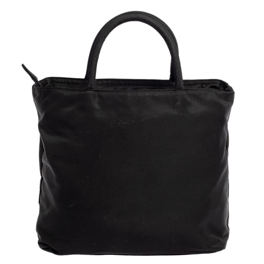 An essential wardrobe accessory, this Prada tote is surely a must-have. Made from a nylon body, this bag can effortlessly be fashioned with both off-duty and formal looks. The inside of this chic bag is beautifully stitched with nylon for