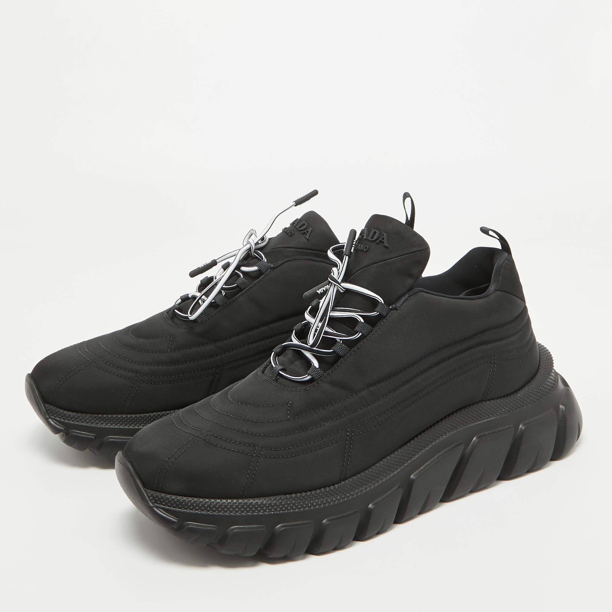 Give your outfit a luxe update with this pair of Prada black sneakers. The shoes are sewn perfectly to help you make a statement in them for a long time.

Includes: Original Box