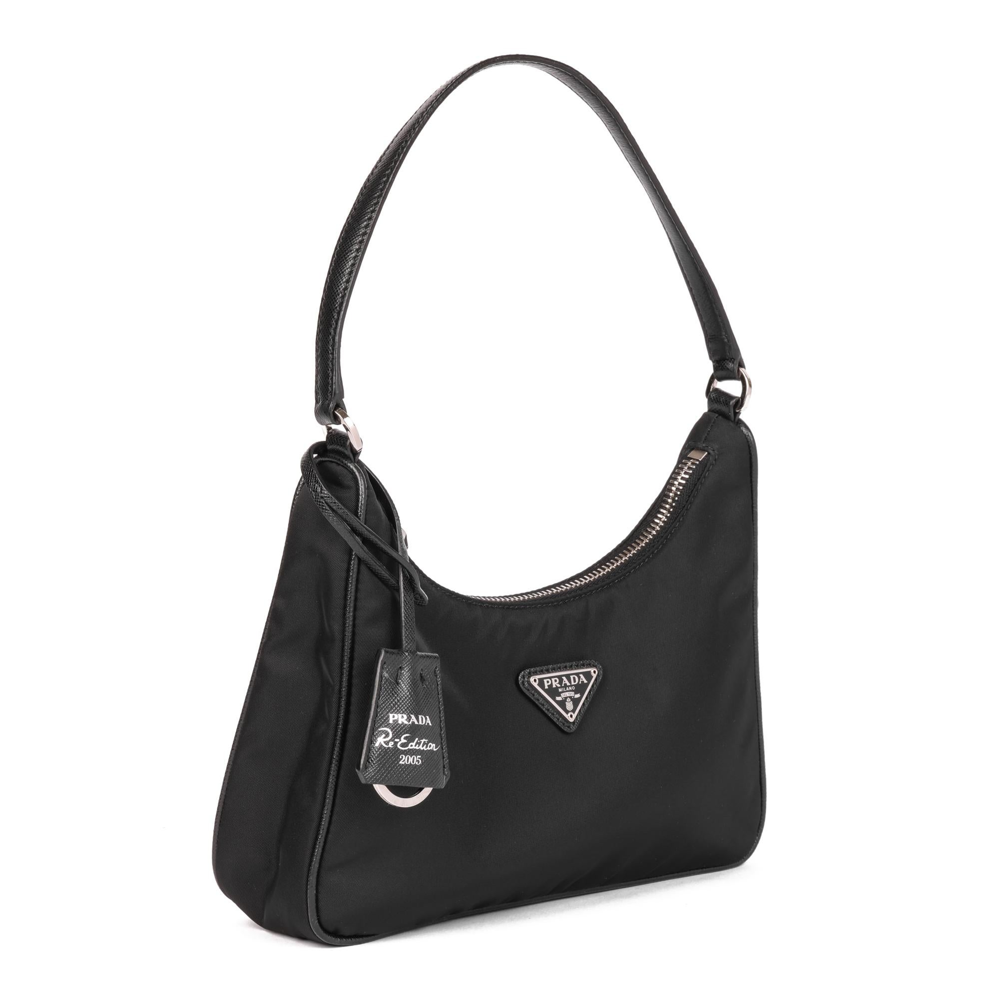 PRADA
Black Nylon Re-Edition 2005 Mini Bag

Xupes Reference: HB4905
Serial Number: 42
Age (Circa): 2020
Accompanied By: Clochette
Authenticity Details: Serial Tag (Made in Italy) 
Gender: Ladies
Type: Top Handle

Colour: Black
Hardware: