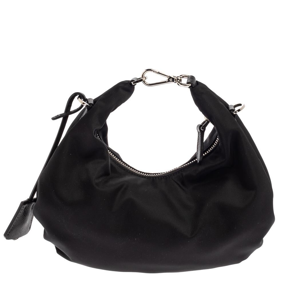 The bag that has caught the instant fancy of celebrities, bloggers, and every one fashionable, Re-Edition 2006 from Prada is one of the IT bags of the season. Designed in a petite silhouette from nylon, the bag is adorned in a black hue and features
