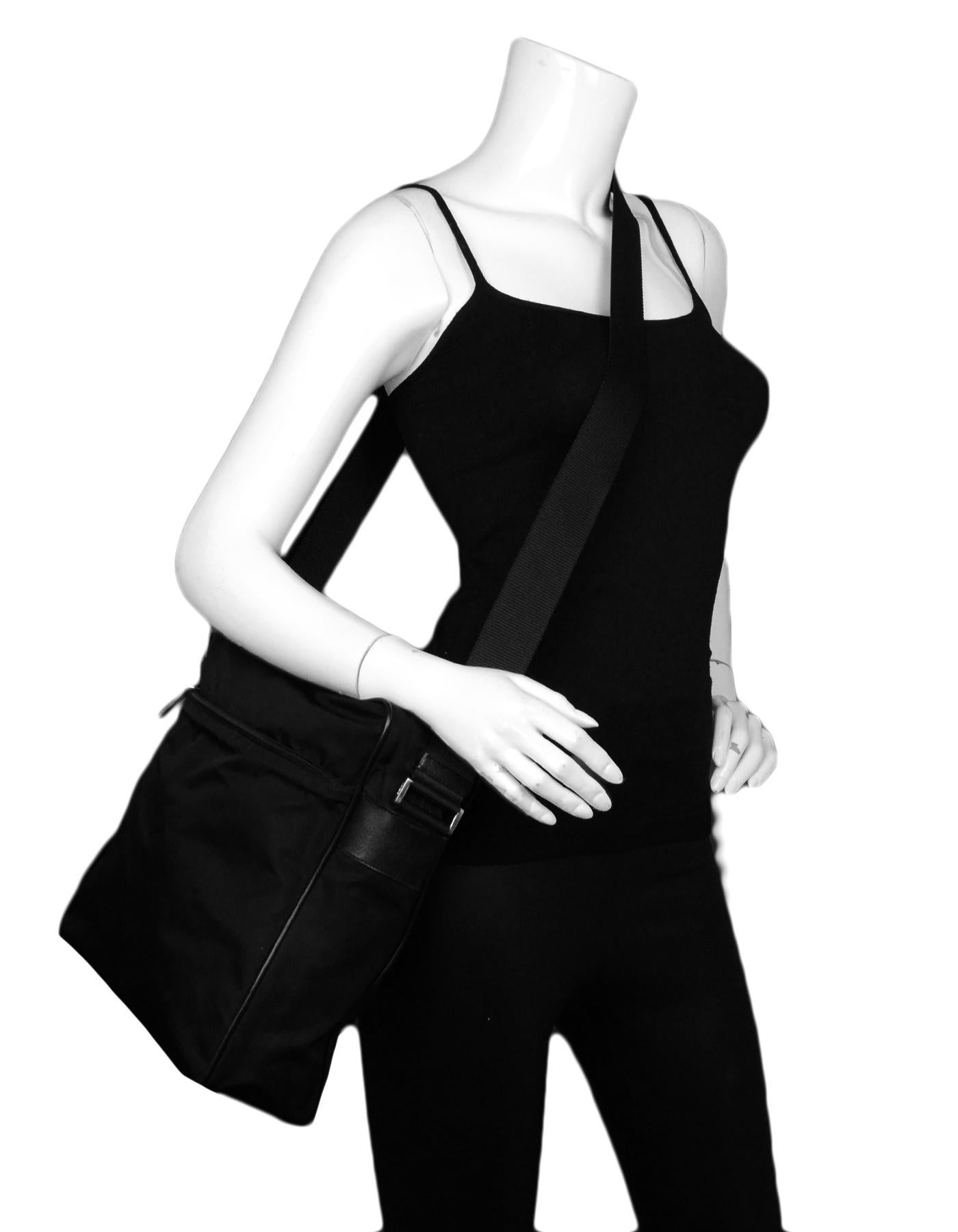 Prada Black Nylon Zip Top Messenger Bag

Made In: Italy
Color: Black 
Hardware: Silvertone 
Materials: Nylon
Lining: Prada fine textile
Closure/Opening: Top zip
Exterior Pockets: One zip pocket
Interior Pockets: One zip pocket
Exterior Condition: