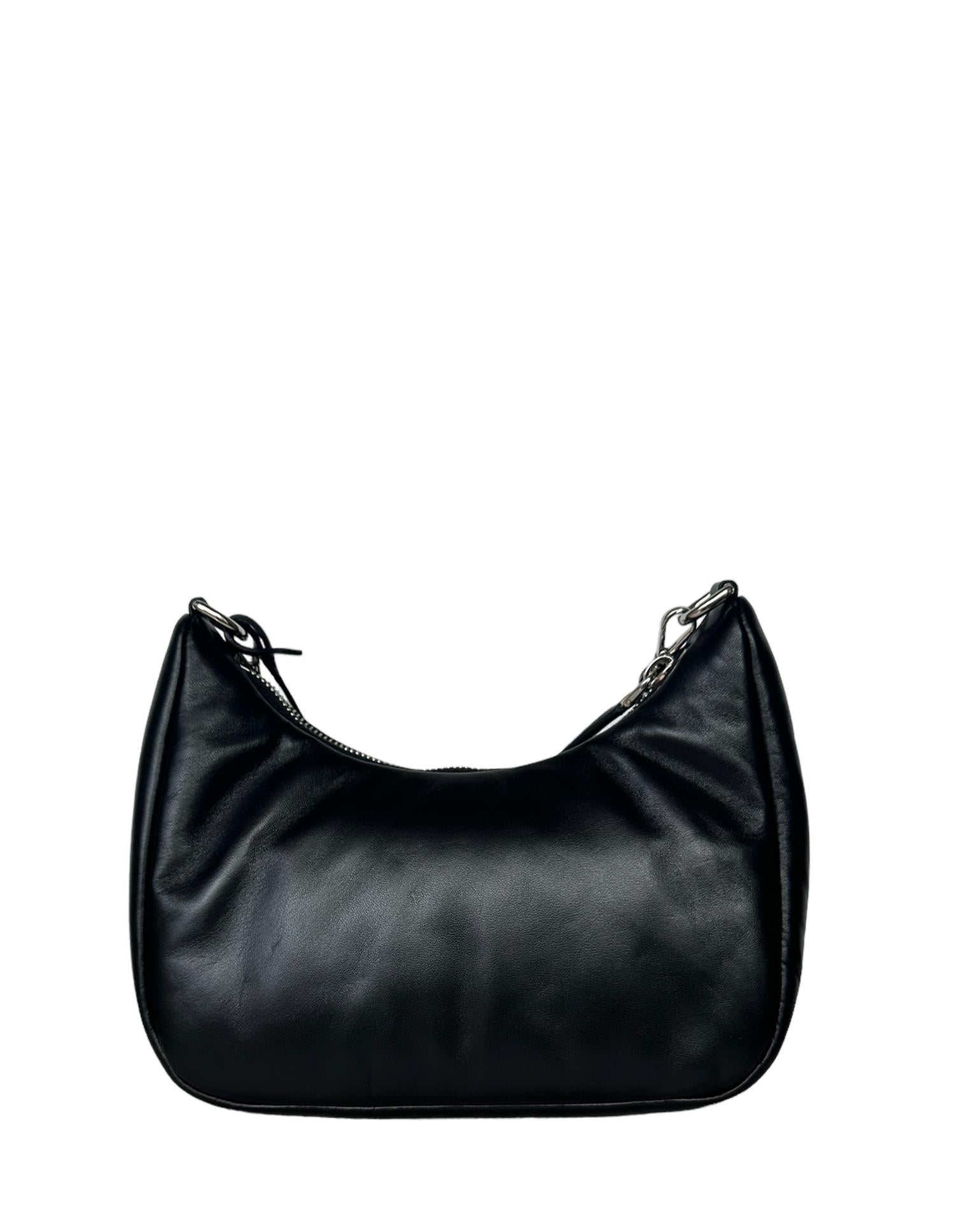 Prada Black Padded Nappa-Leather Re-Edition 2005 Shoulder Bag

Made In: Italy
Year of Production: 2022
Color: Black
Hardware: Silvertone
Materials: Nappa leather and canvas
Lining: Black smooth leather
Exterior Pockets: None
Interior Pockets: