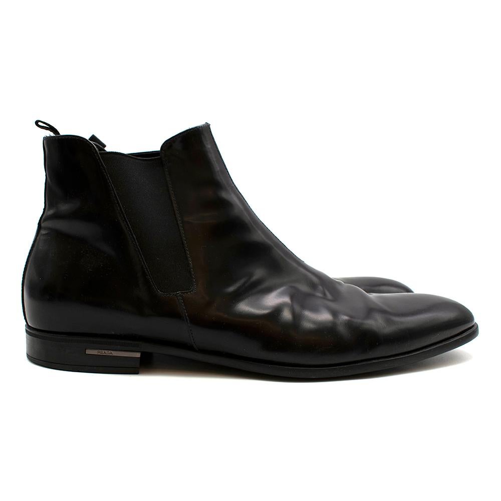 Prada Black Patent Leather Chelsea Boots

- Classic Chelsea Boot style 
- Glossed black patent leather 
- Almond toe
- Rubber heel featuring a silver Prada emblem 
- Pull tabs and elasticated panels for easy pull-on 

Materials: 
Main - 100% Leather