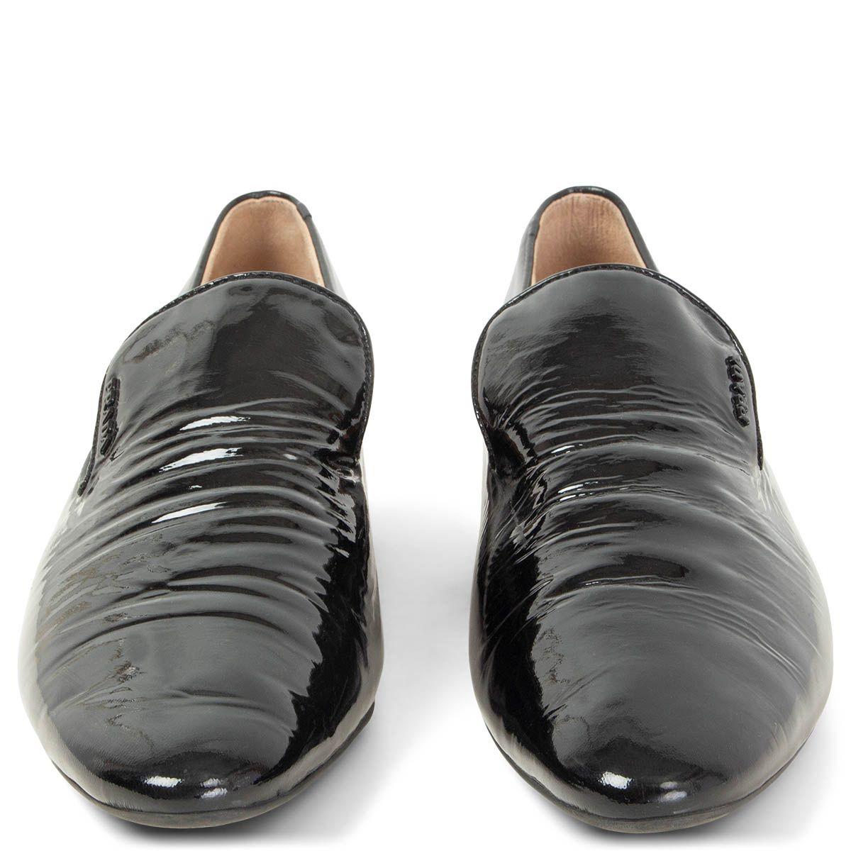 100% authentic Prada almond-toe black patent leather loafers. Have been worn once and show some creasing. Overall in excellent condition. 

Measurements
Imprinted Size	39.5
Shoe Size	39.5
Inside Sole	26.5cm (10.3in)
Width	7.5cm (2.9in)
Heel	2.5cm