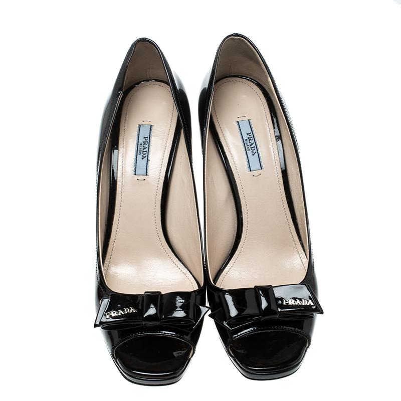 Designed to last, these pumps are from the luxury house of Prada. Make a bold style statement with this dazzling black pair. Make heads turn as you step out in this leather-lined footwear, for that day out with friends.

Includes: Original Dustbag

