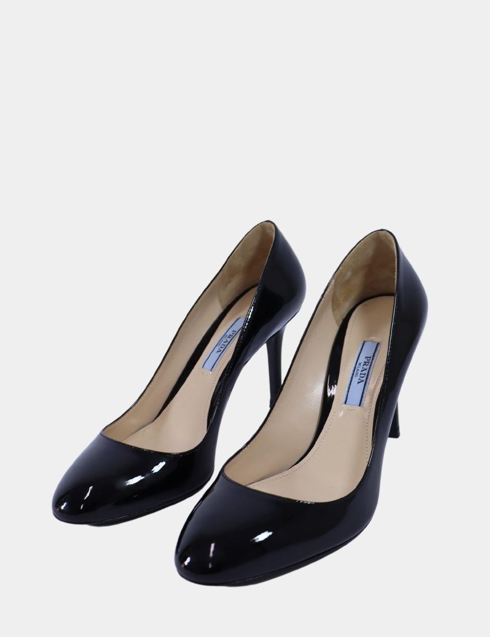 Prada Black Patent Leather Pumps, Features a Round Toe, 85mm Heel, and Patent Leather.

Material: Leather
Size: EU 36
Heel Height: 8.5cm
Condition: Excellent