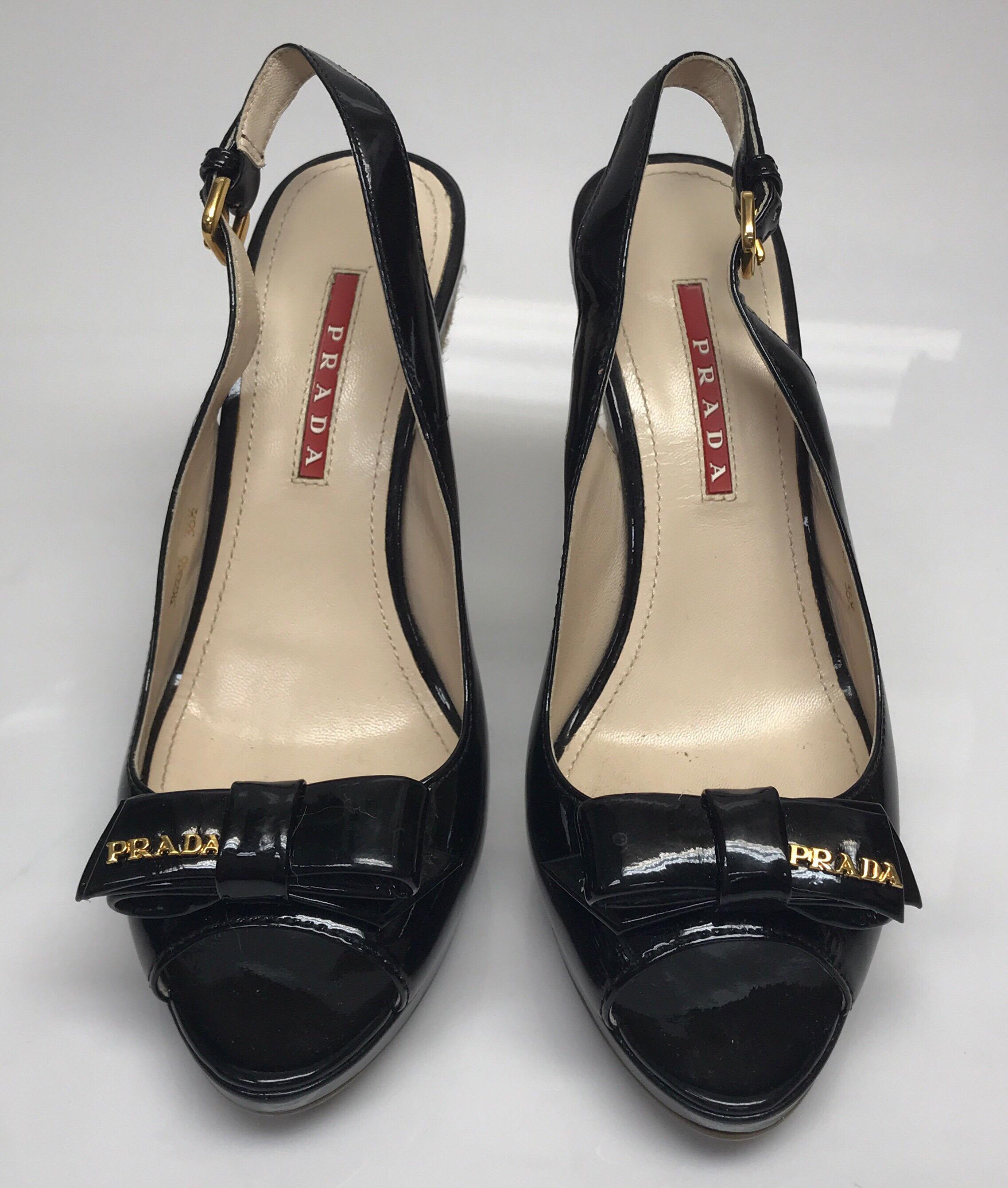 PRADA BLACK Patent w/ Bow on top Wedges - 36.5. These beautiful Prada wedges are in excellent condition. they show barely any sign of use, with exception to the bottom having minor smudges on it. These wedges are made of braided twine-like material