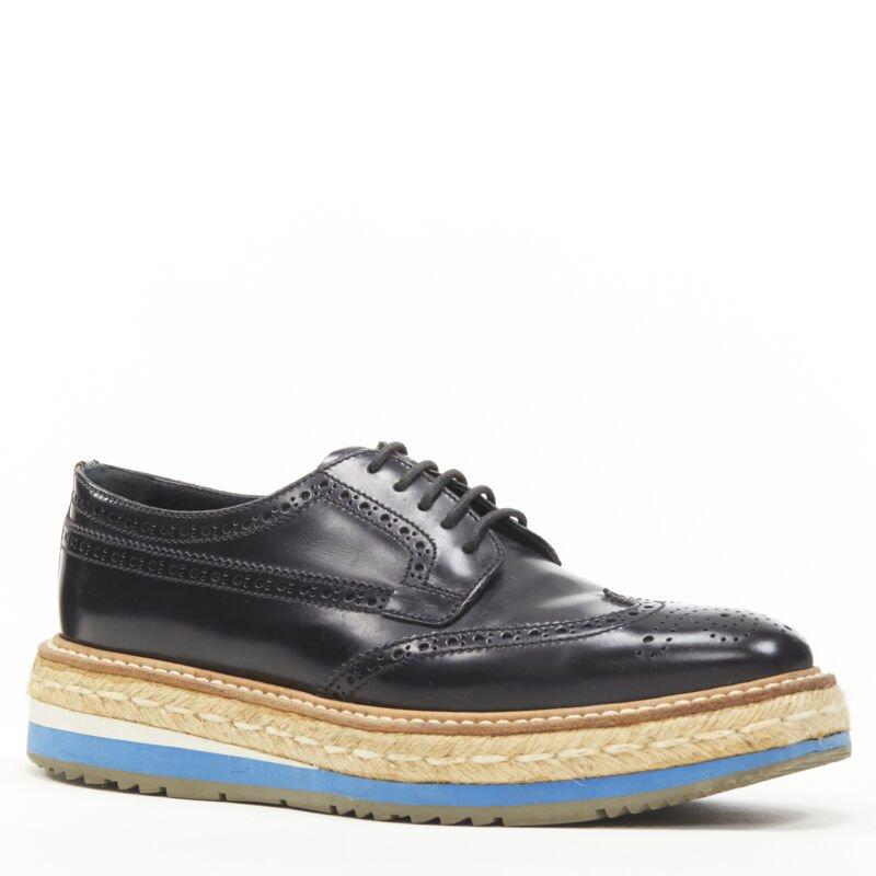 PRADA jute espadrille compensée en cuir perforé noir EU36,5
Référence : ANWU/A00178
Marque : Prada
Designer : Miuccia Prada
MATERIAL : Cuir
Couleur : noir, bleu
Motif : Solide
Fermeture : Up&Up
Doublure :  Cuir
Fabriqué en : Italie

CONDITION
