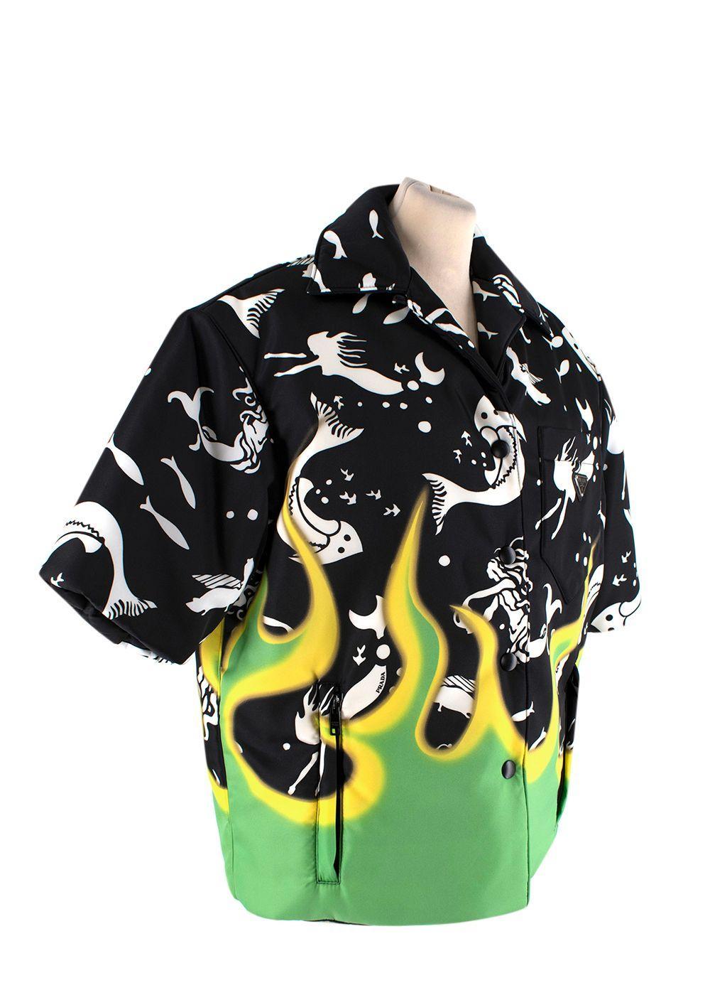 Prada Black, Green & Yellow Print Padded Nylon Shirt

- AW18
- Lightly padded shirt silhouette, can be worn as a top or jacket
- White marine motifs and signature flame hem
- Snap-button closure
- One patch and two zipped pockets

Materials:
64%