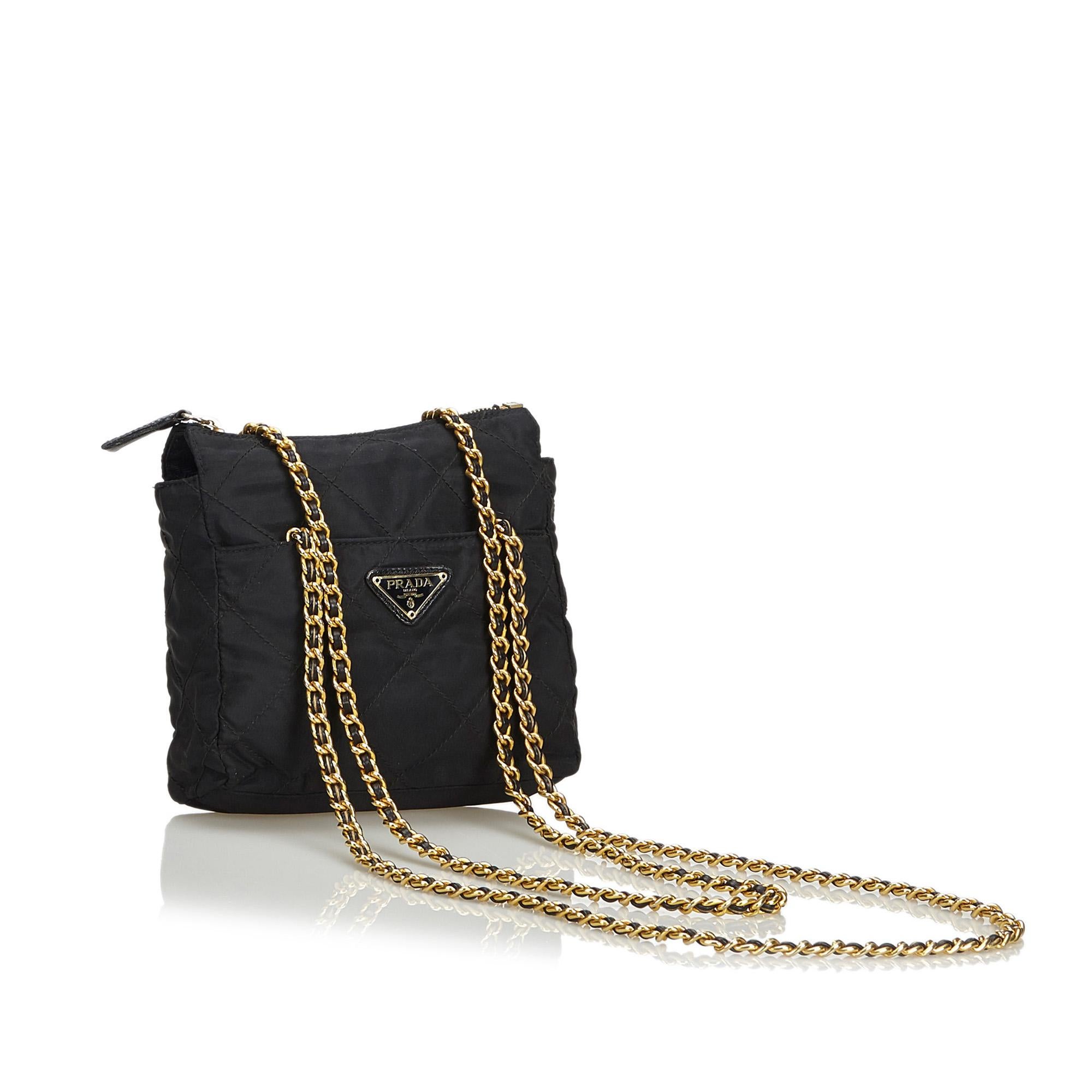 This tote bag feature a quilted nylon body, chain straps, top zip closure, and interior zip pocket. It carries as B+ condition rating.

Inclusions: 
This item does not come with inclusions.

Dimensions:
Length: 17.00 cm
Width: 21.00 cm
Depth: 4.50