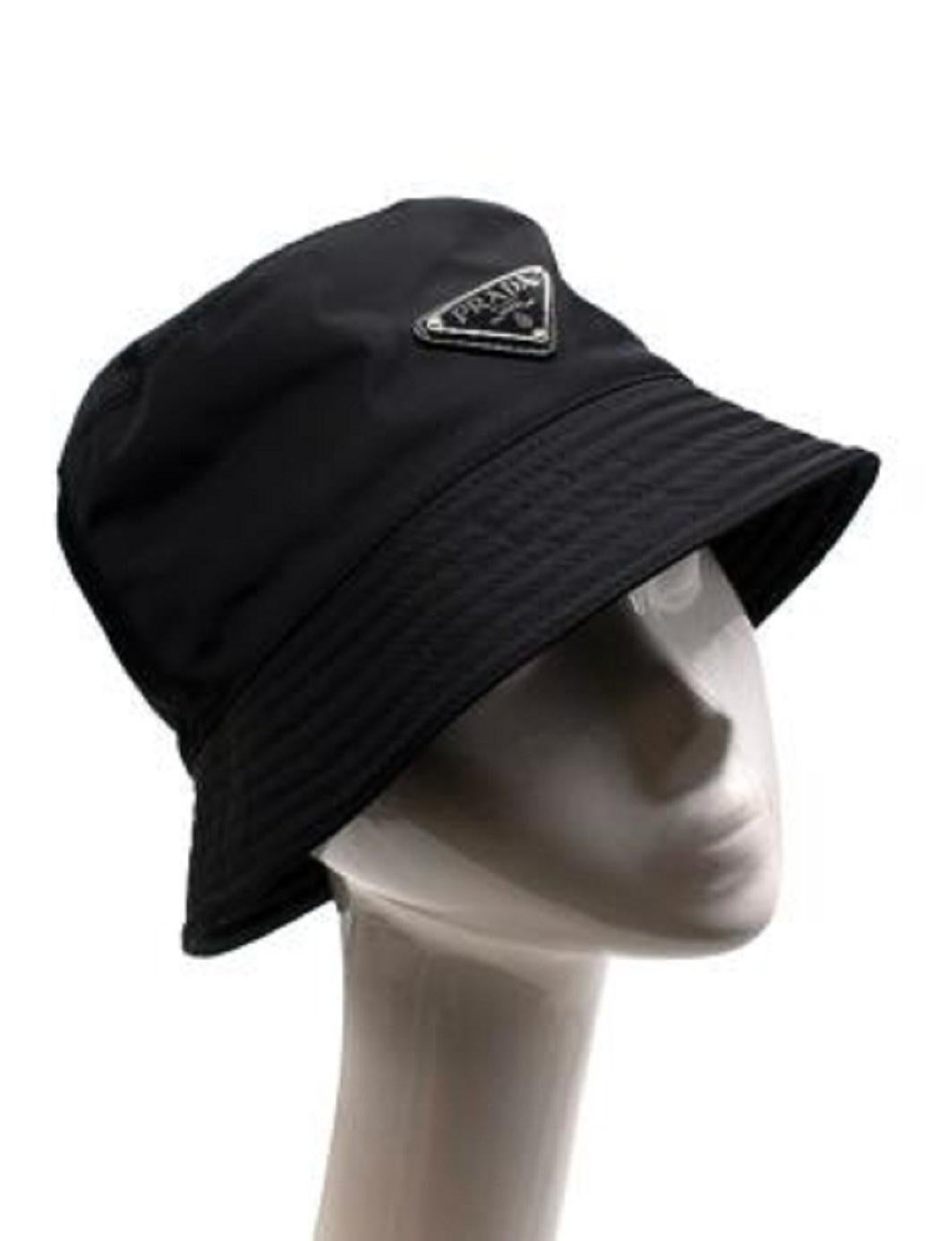 Prada Black Nylon Bucket Hat

-Featuring logo plaque
-Tonal stitching 
-Made from at least 50% recycled or up-cycled materials
-Lined 

Material: 

Re-Nylon 

Made in Italy 

PLEASE NOTE, THESE ITEMS ARE PRE-OWNED AND MAY SHOW SIGNS OF BEING STORED