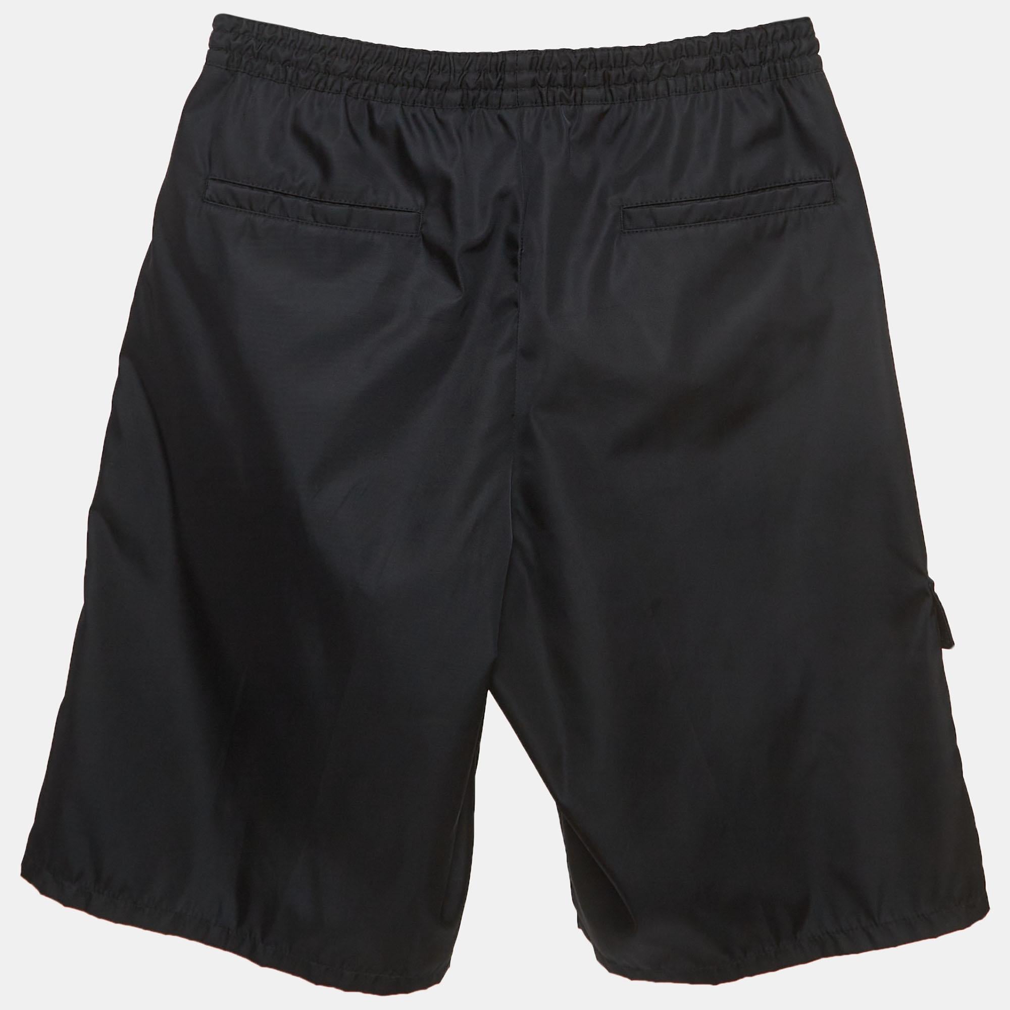Crafted with meticulous attention to detail, the Prada shorts exude effortless style and practicality. Made from high-quality, sustainable materials, they feature a versatile drawstring waist and Bermuda length, combining comfort with a contemporary