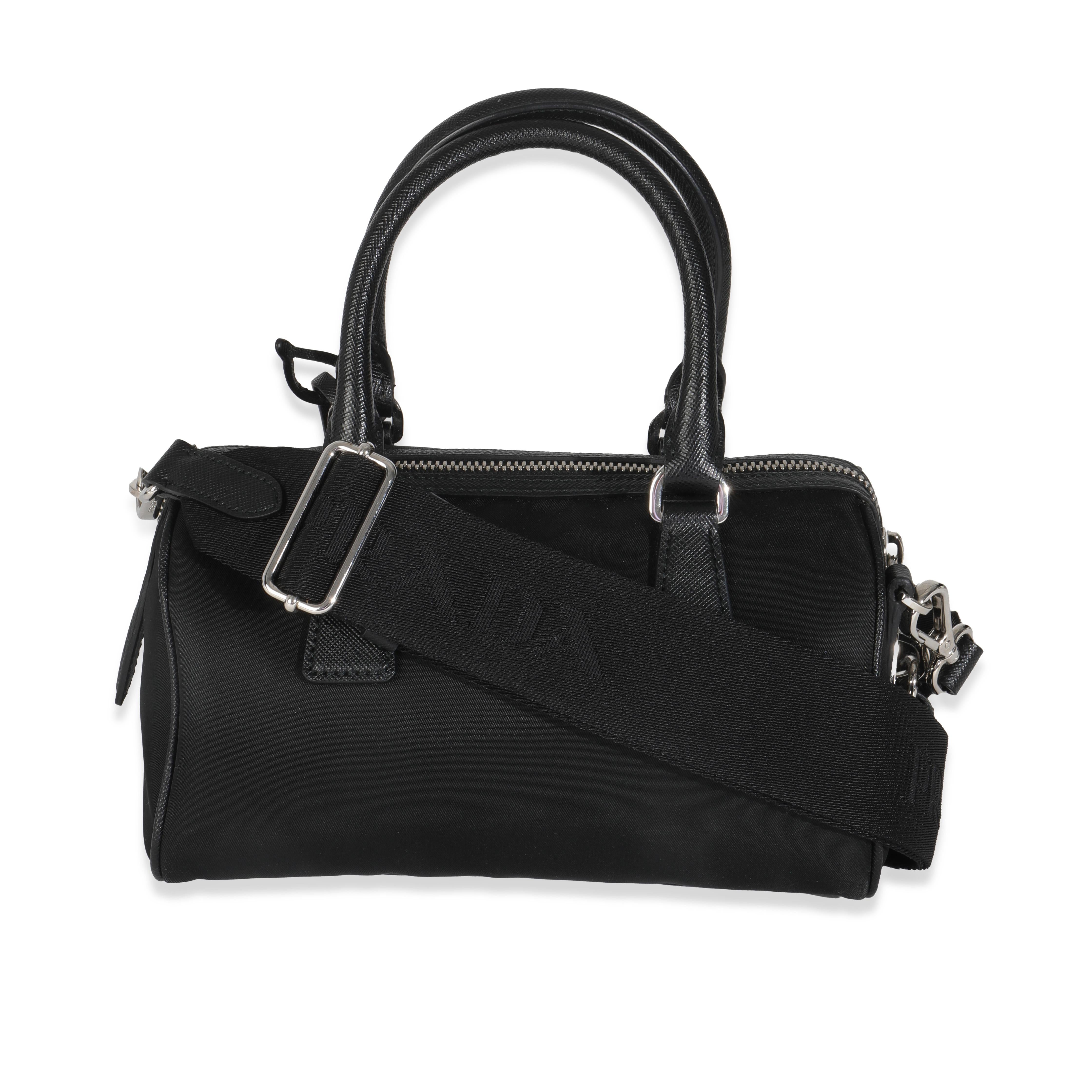 Listing Title: Prada Black Re-Nylon Re-Edition 2005 Top Handle Crossbody Bag
SKU: Z145227
Condition: Pre-owned 
Handbag Condition: Excellent
Condition Comments: Item is in excellent condition and displays light signs of wear.  Faint marks along