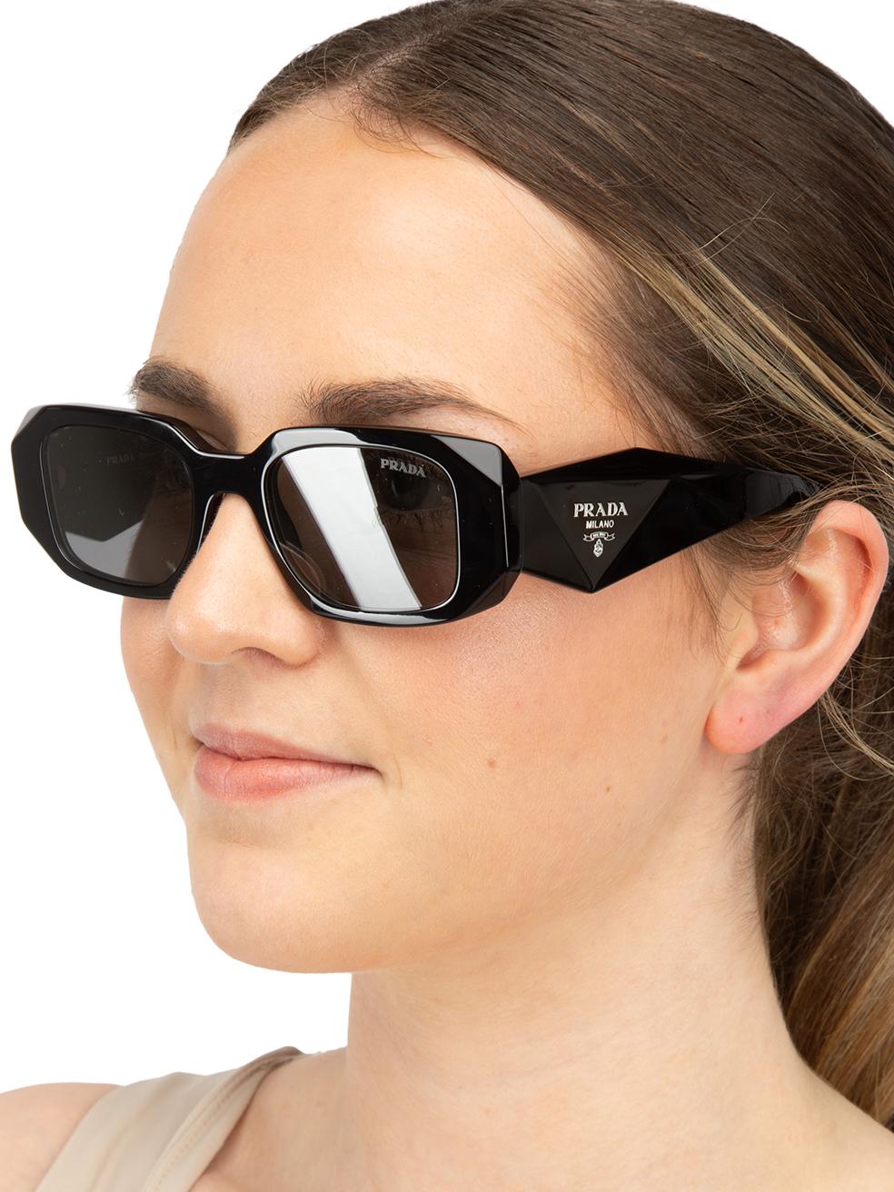 CONDITION is New with tags. No visible wear to sunglasses is evident on this new Prada designer resale item. This item comes with original packaging.
 

 
 Details
 
 
 Model: 0PR 17WS
 
 Black
 
 Acetate
 
 Rectangular sunglasses
 
 Grey tinted