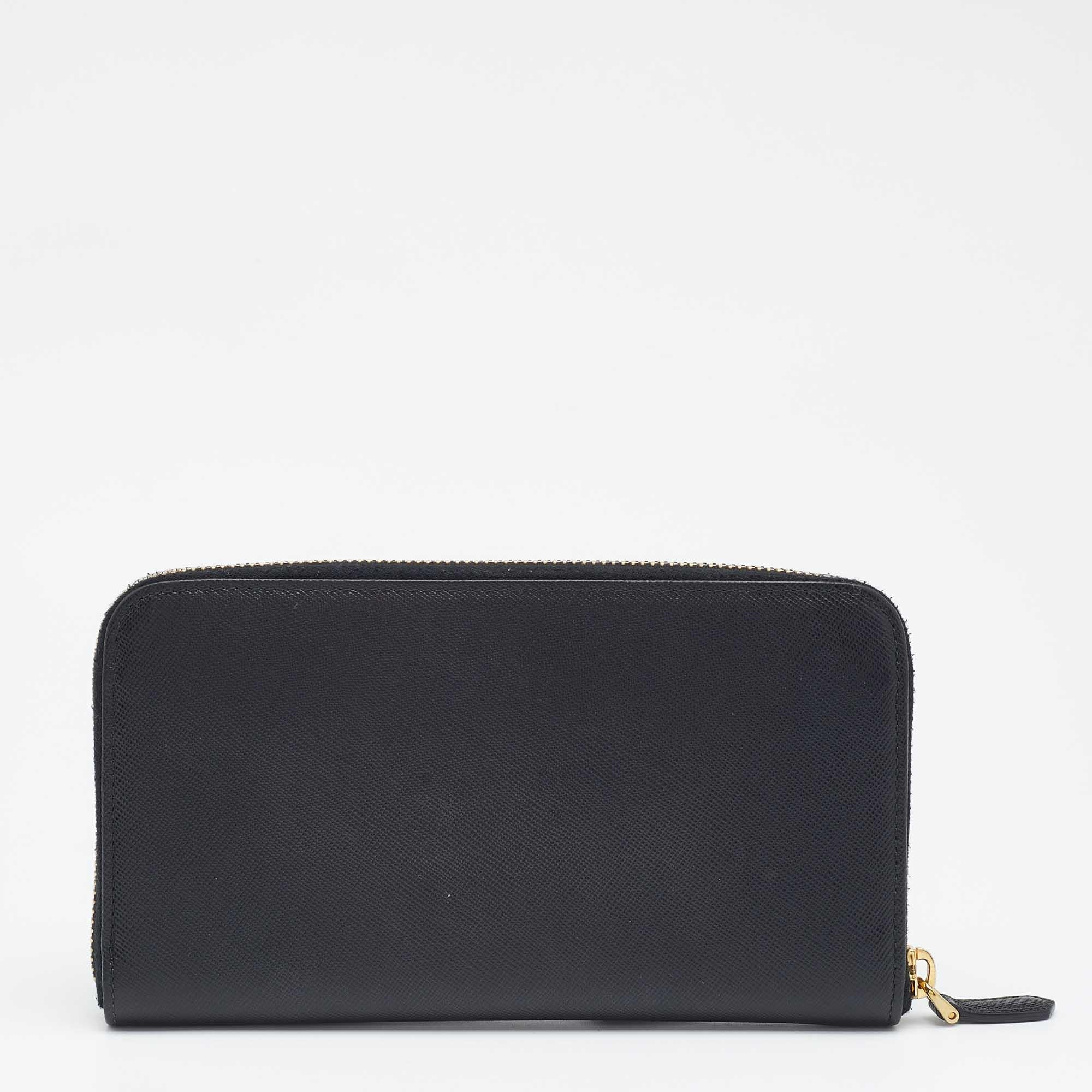 Store your monetary essentials hassle-free in this wallet from Prada. Durable and stylish, it is crafted from Saffiano leather in a black shade. The zip-around closure secures multiple compartments, and the front is adorned with a logo accented