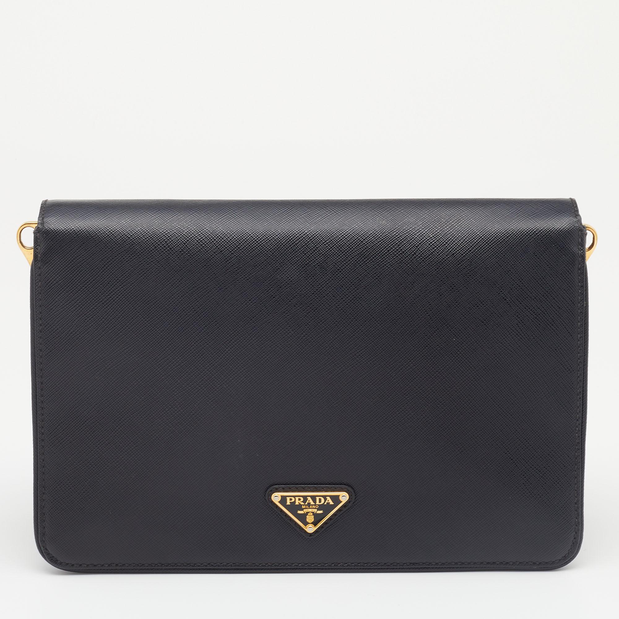 Now here's a bag that is both stylish and functional! Prada brings us this Cinghiale crossbody bag that will make you look glamorous! It is made from black Saffiano leather and is highlighted with gold-tone hardware. It is completed with an