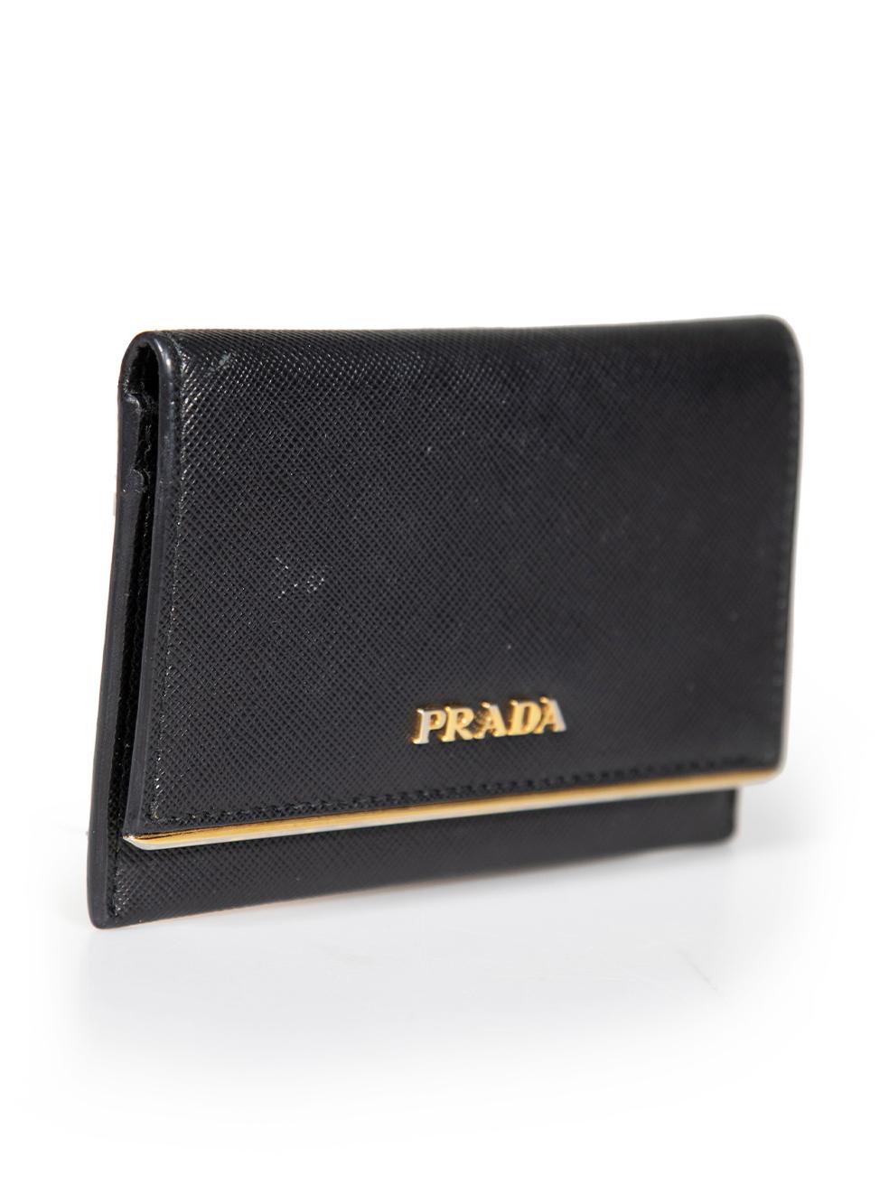 CONDITION is Very good. Minimal wear to wallet is evident. Minimal wear to the front with a small abrasion and the logo lettering has started to tarnish on this used Prada designer resale item.
 
 
 
 Details
 
 
 Black
 
 Saffiano leather
 
 Card
