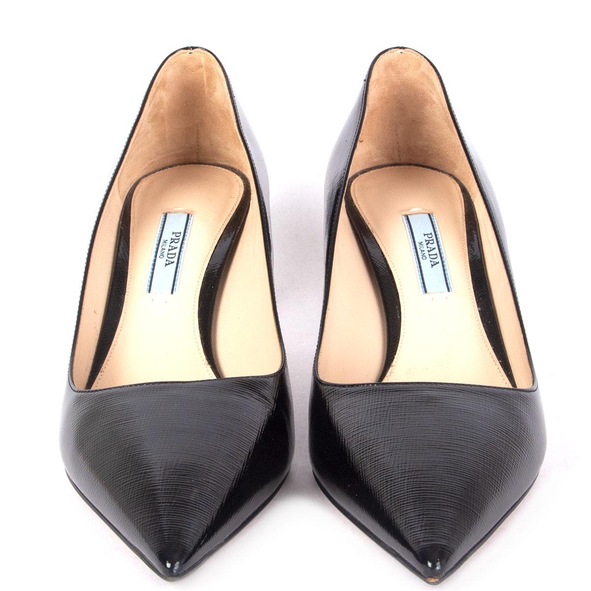 100% authentic Prada pointed-toe pumps in black patent Saffiano leather. Have been worn and are in excellent condition. 

Imprinted Size 38
Shoe Size 38
Inside Sole 25.5cm (9.9in)
Width 7.5cm (2.9in)
Heel 6.5cm (2.5in)

All our listings include only