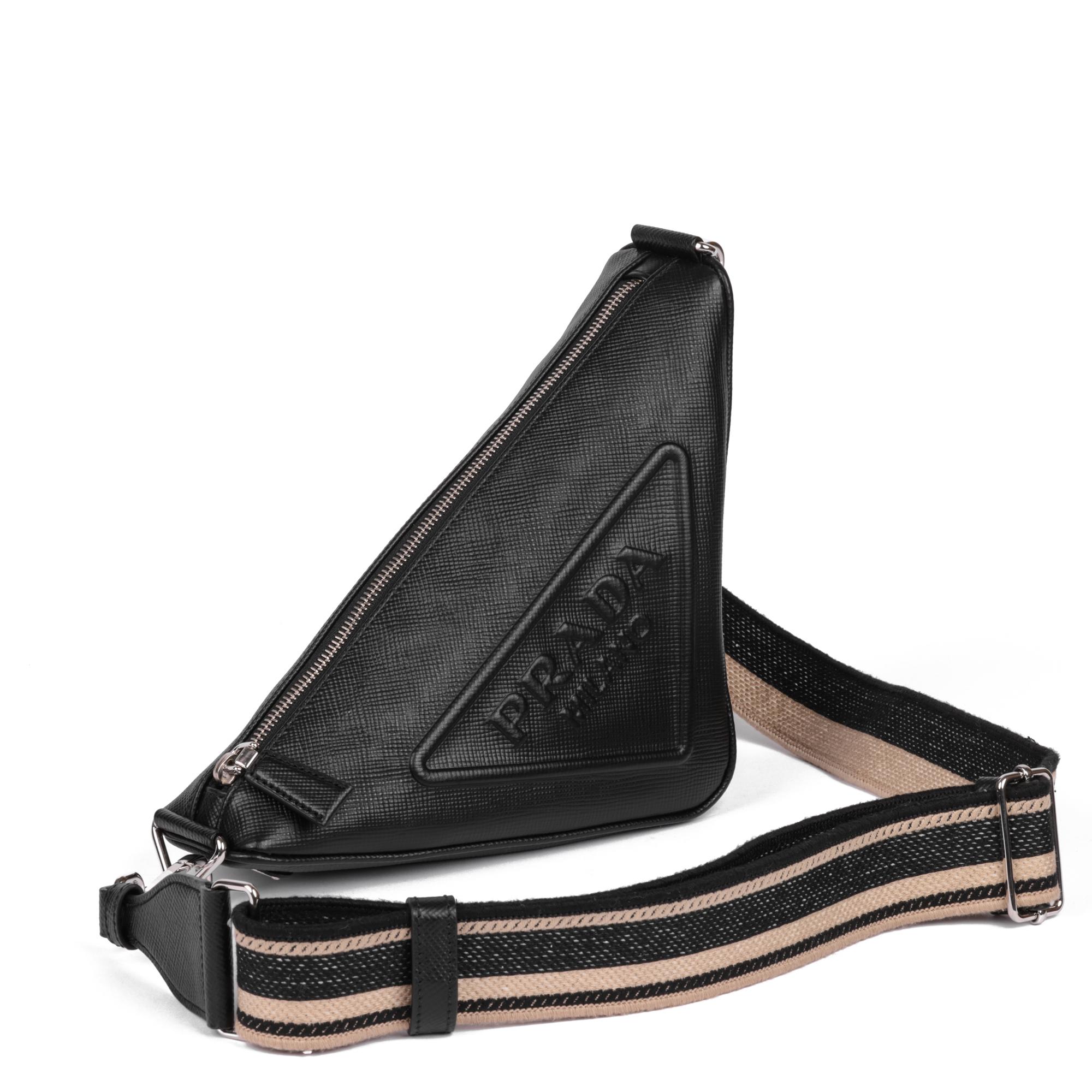 PRADA
Black Saffiano Leather Triangle Shoulder Bag

Serial Number: 7/D
Age (Circa): 2022
Accompanied By: Prada Dust Bag
Authenticity Details: Serial Tag (Made in Italy)
Gender: Ladies
Type: Shoulder, Crossbody

Colour: Black
Hardware: