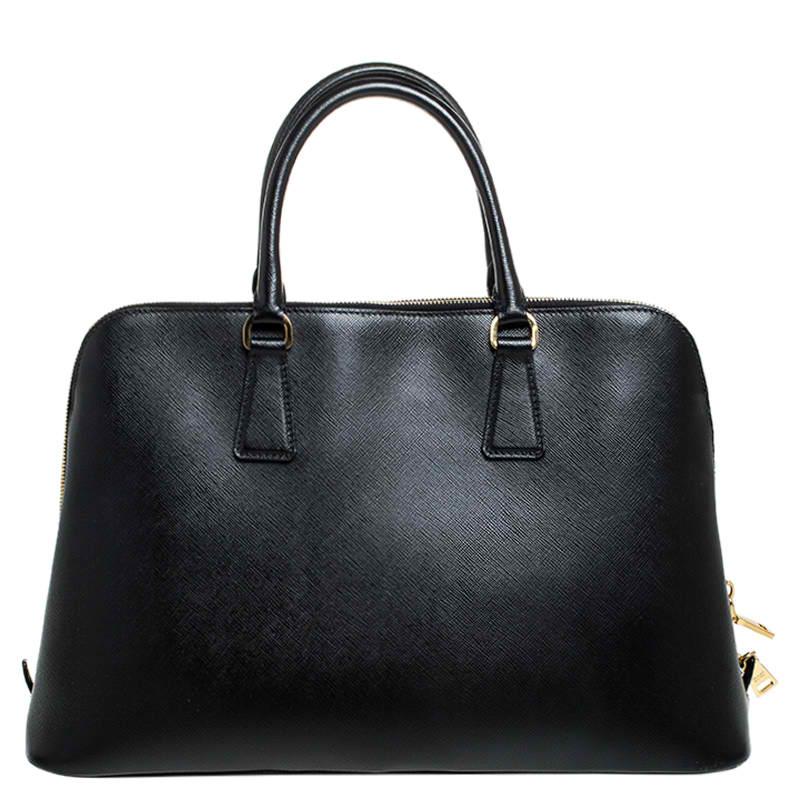 This stunning Promenade bag is high on appeal and style. Dazzling in a classy black shade, the bag is crafted from leather and features two rolled handles. The zip closure leads way to a nylon interior with enough space for your essentials and the