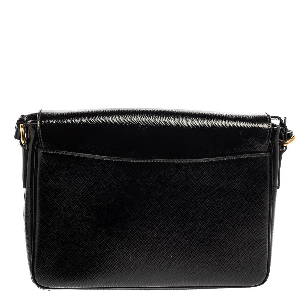 When it’s Prada, you know it’s special! Made of Saffiano Vernice leather, this black bag with the metal lock can be easily carried off with a lot of outfits as it’s easy, light, and beautiful! It comes with an adjustable strap and pockets inside to