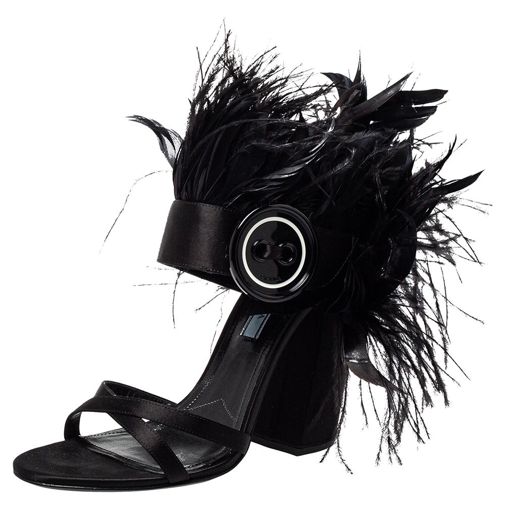 These sandals from Prada are one of a kind in every trendy woman's footwear collection. Look glamorous no matter what you wear, with these beautiful satin & feather shoes flaunting crisscross vamp straps, dramatic feather detailing, and ankle