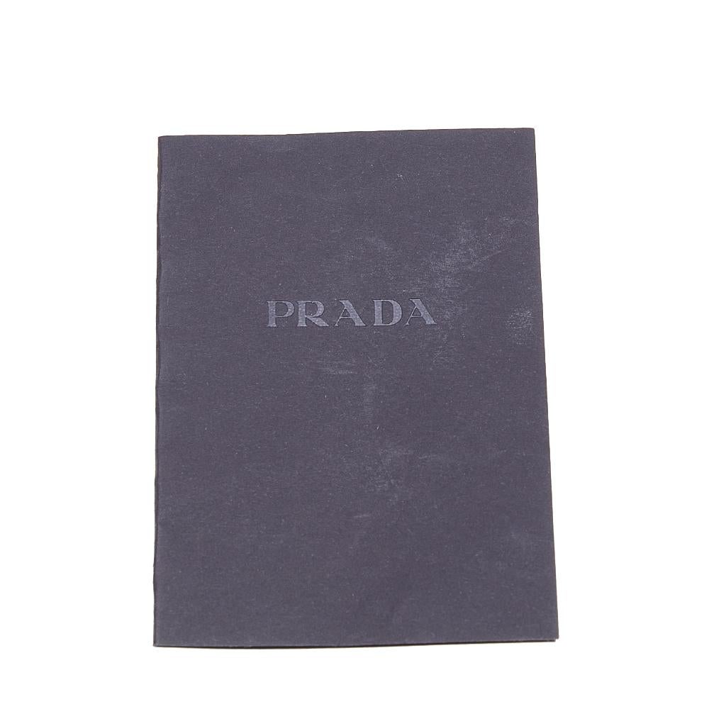Add this super-stylish Prada clutch to your bag collection for a fashion upgrade! The elegant piece is oversized and created from black satin. With its simple design and roomy interior, you can carry it effortlessly.

Includes: Original Dustbag,