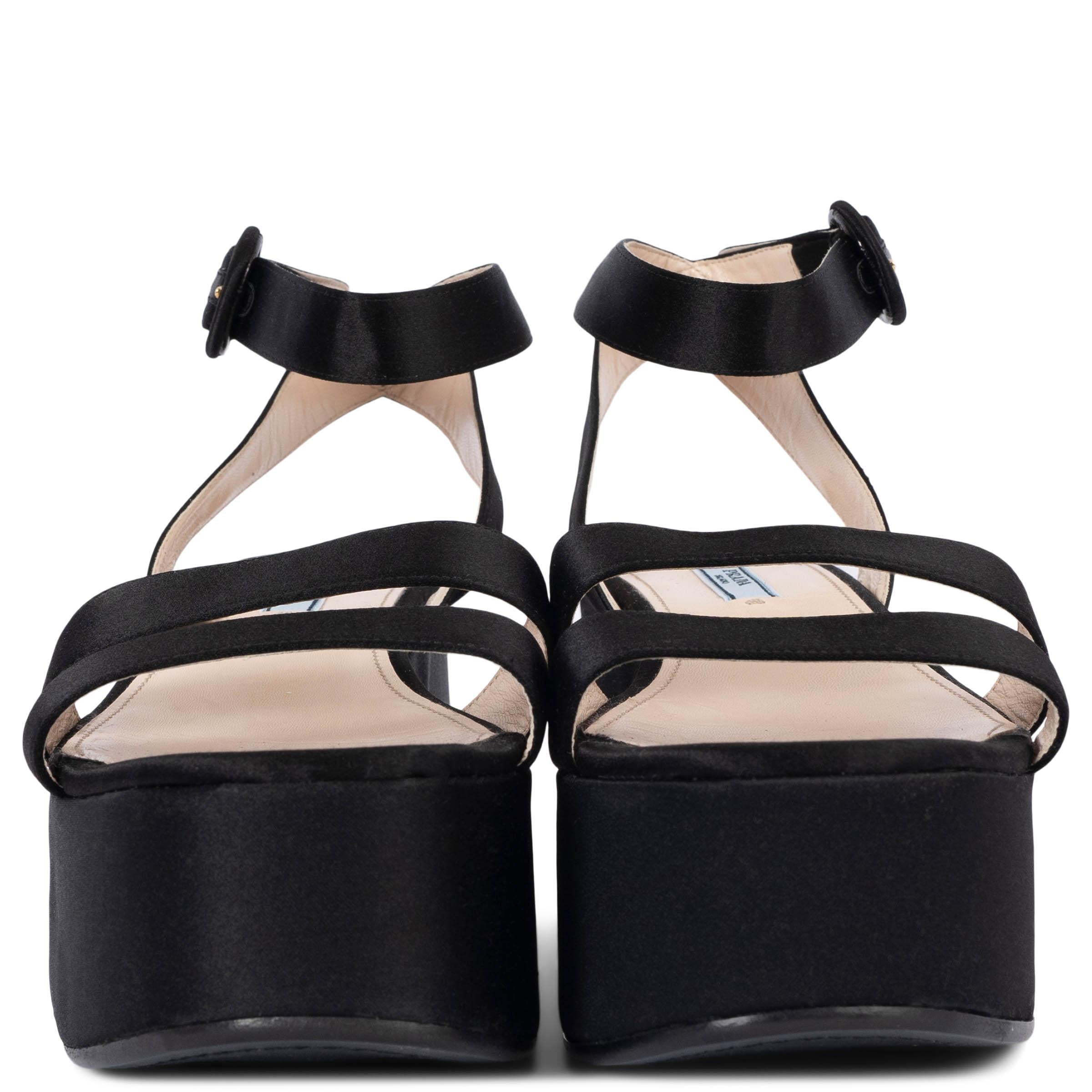100% authentic Prada ankle-strap platform wedge sandals in black satin. Have been worn once and are in virtually new condition. 

Measurements
Imprinted Size	40.5
Shoe Size	40.5
Inside Sole	26.5cm (10.3in)
Width	8cm (3.1in)
Heel	8cm