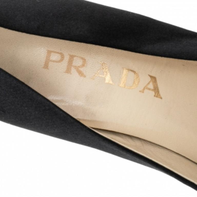 Make a classy addition to your wardrobe with these pumps by Prada. Sophisticated and stylish, they feature a black satin exterior and a slip-on style. The beautifully crafted pumps will amp up your look of the day.